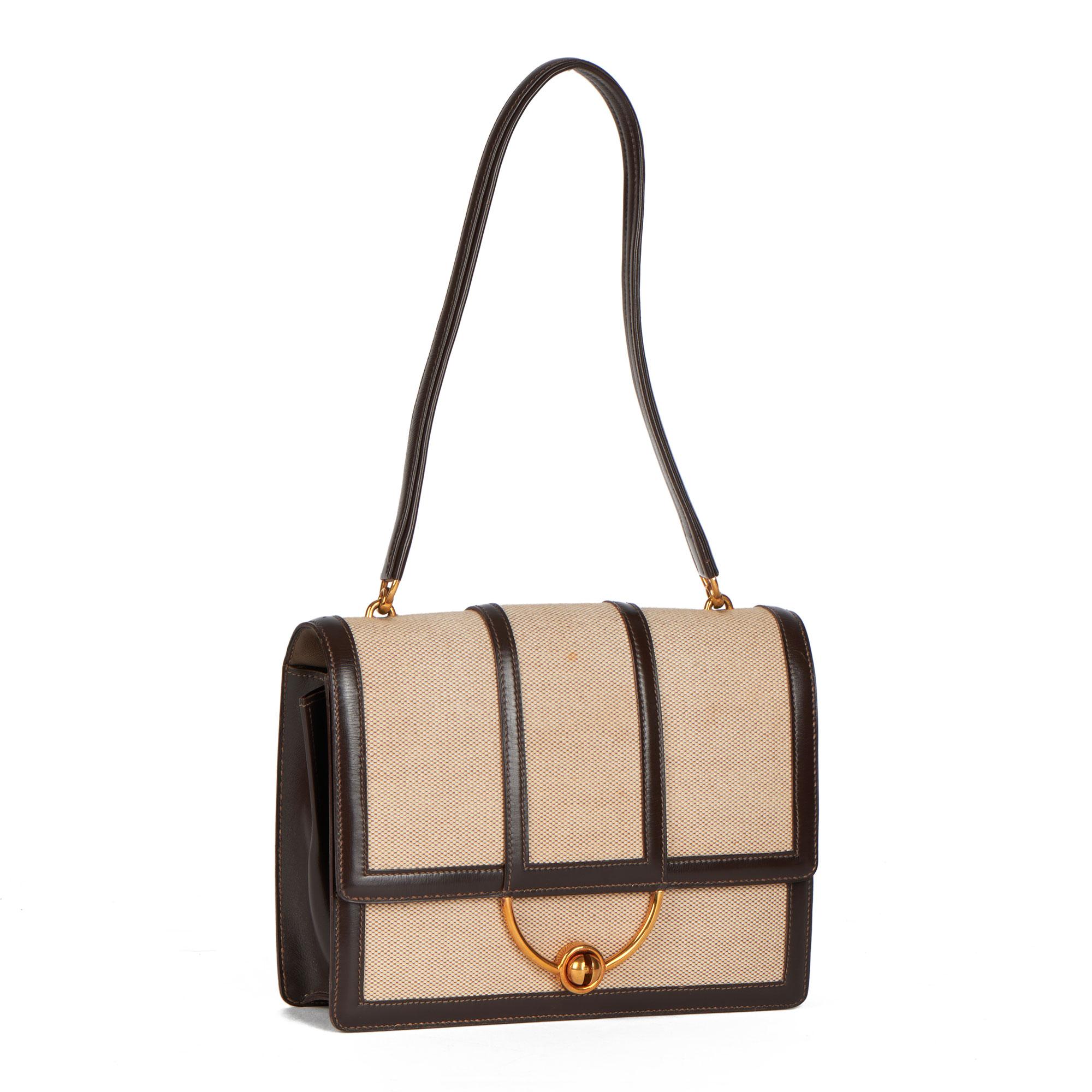 HERMÈS
Brown Box Calf Leather & Beige Canvas Vintage Ring Flap Bag

Xupes Reference: CB380
Serial Number: (B)
Age (Circa): 1972
Authenticity Details: Date Stamp (Made in  France)
Gender: Ladies
Type: Top Handle, Shoulder

Colour: Brown
Hardware: