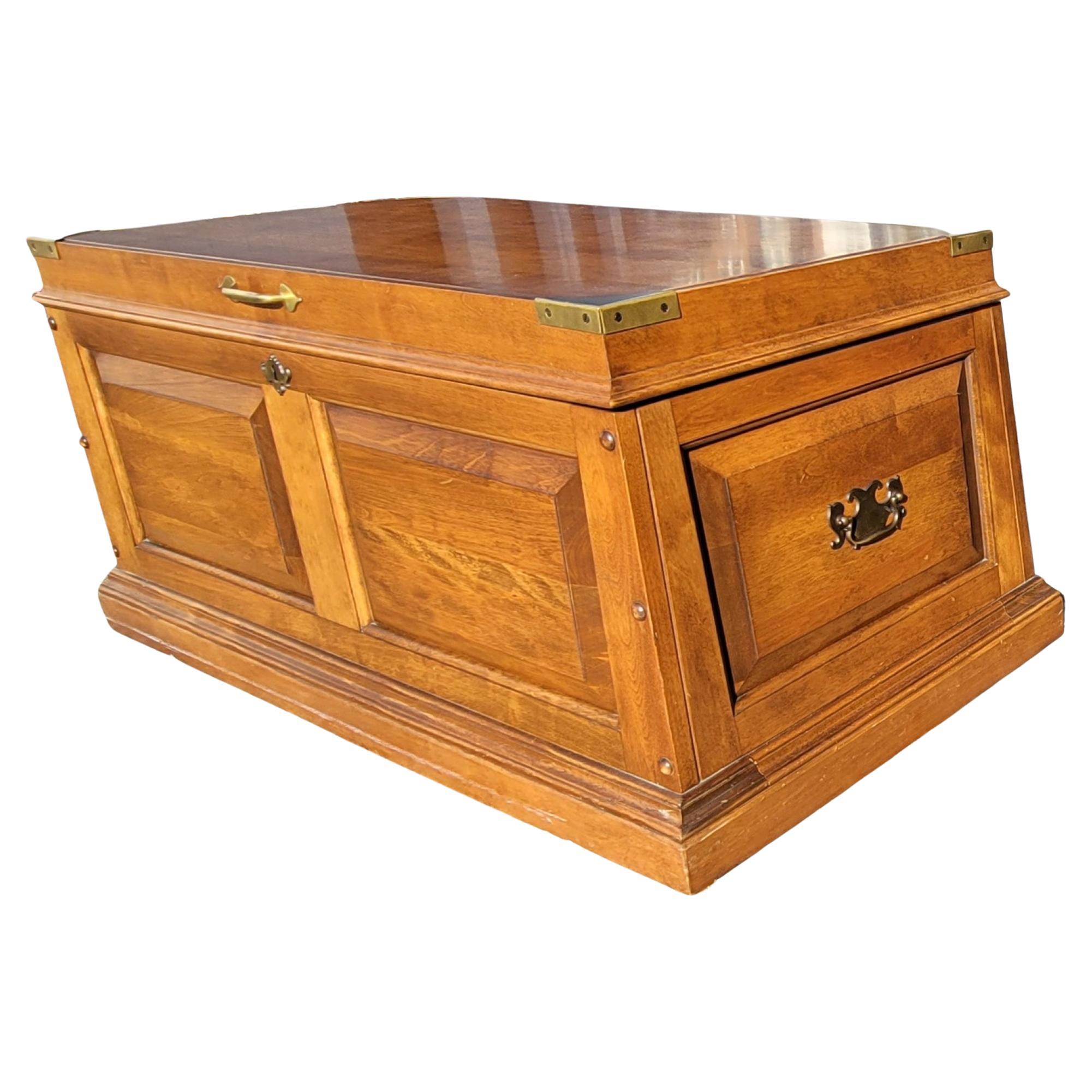 A very well kept 1972 Pennsylvania House campaign style coffee table with Storage Chest in Solid Cherry throughout and panelized sides. Excellent condition with virtually no scratches. Dovetail joints and both brass handles and brass fittings in