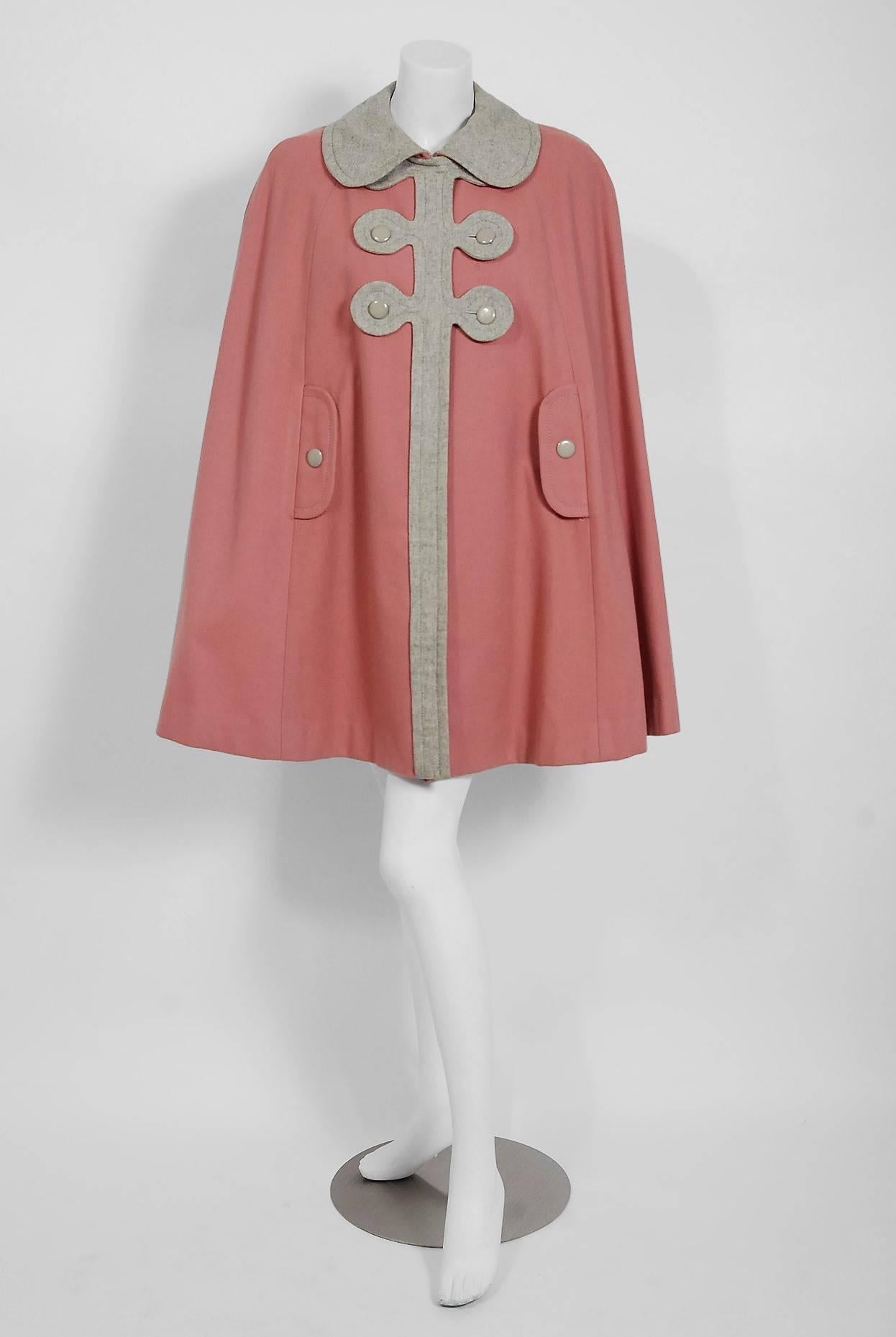 Breathtaking Pierre Cardin Paris designer cape in a unique mauve-pink and gray color combination. In 1951 Cardin opened his own couture house and by 1957, he started a ready-to-wear line; a bold move for a French couturier at the time. The look most