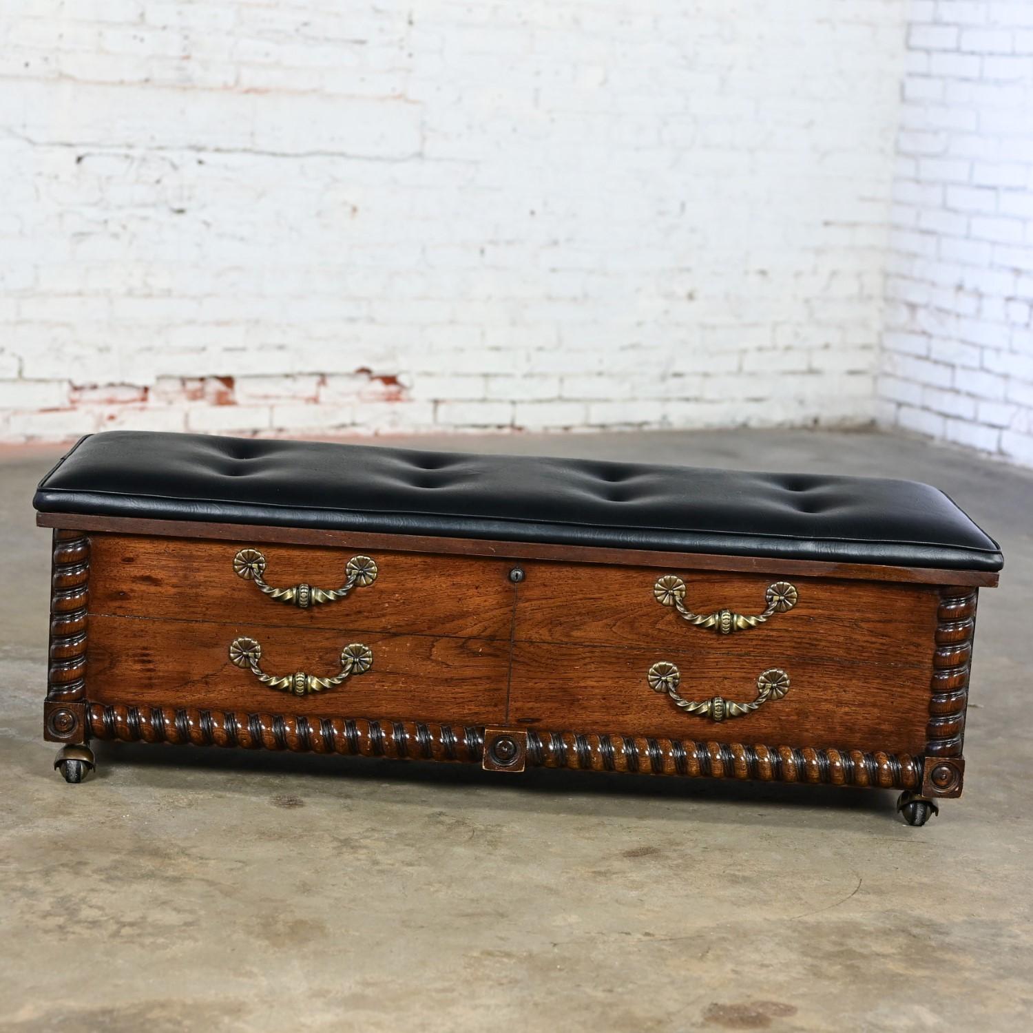 Gorgeous vintage Spanish Revival or Mediterranean Lane locking cedar chest with a new black vinyl bench top with button detail, twisted cast brass handles, antique brass toned ball casters, new key, and original paperwork. Beautiful condition,