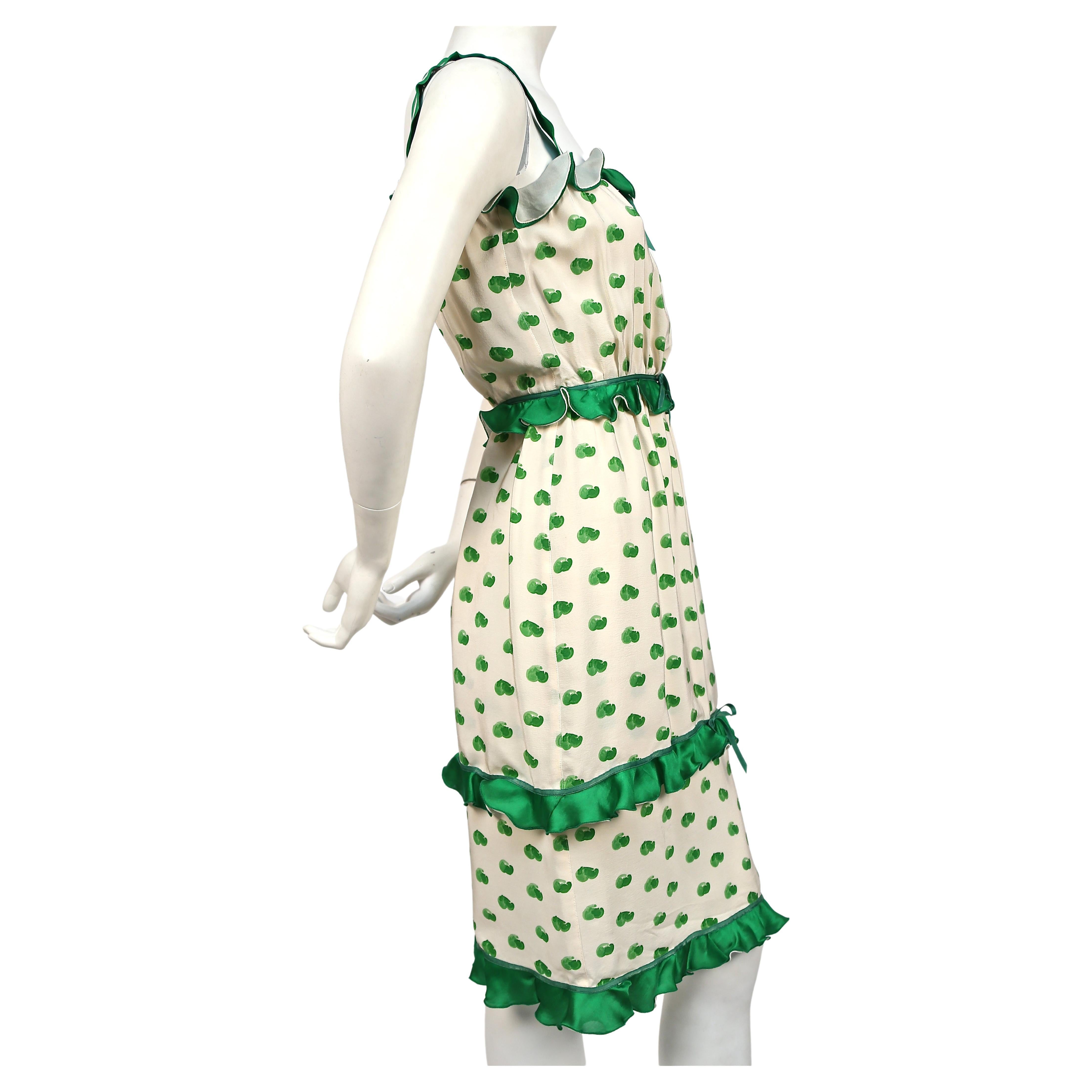 Green and off-white abstract printed silk dress with ruffles from Andre Courreges dating to the 1973. Labeled a Courreges '00' which fits a size 0/2. Approximate measurements: bust 30