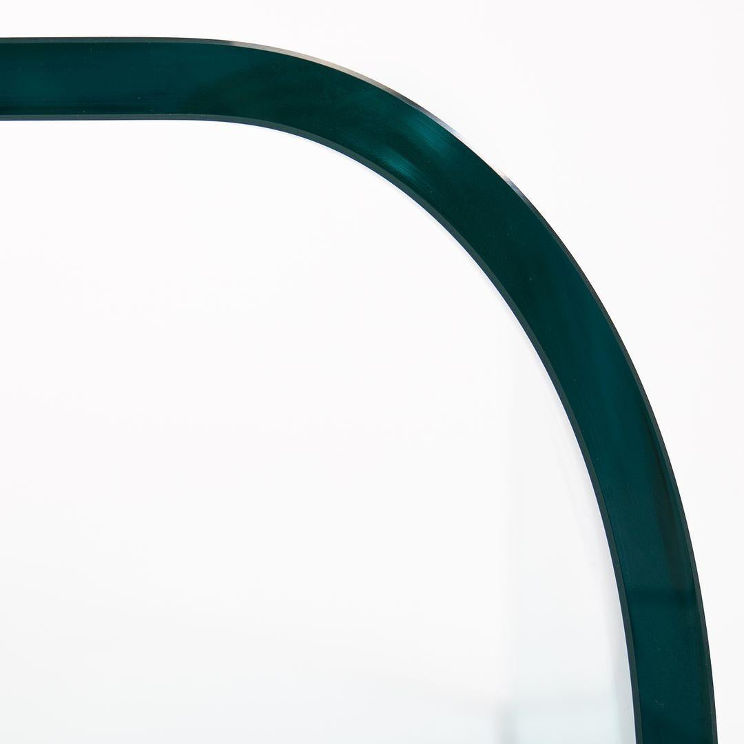 This is a Ponte Coffee Table, designed by Angelo Cortesi for Fiam in 1973. The piece is formed of thick curved transparent glass, manufactured in Italy by Fiam‚Äôs master glassworkers. Fiam is widely considered the preeminent glass furniture