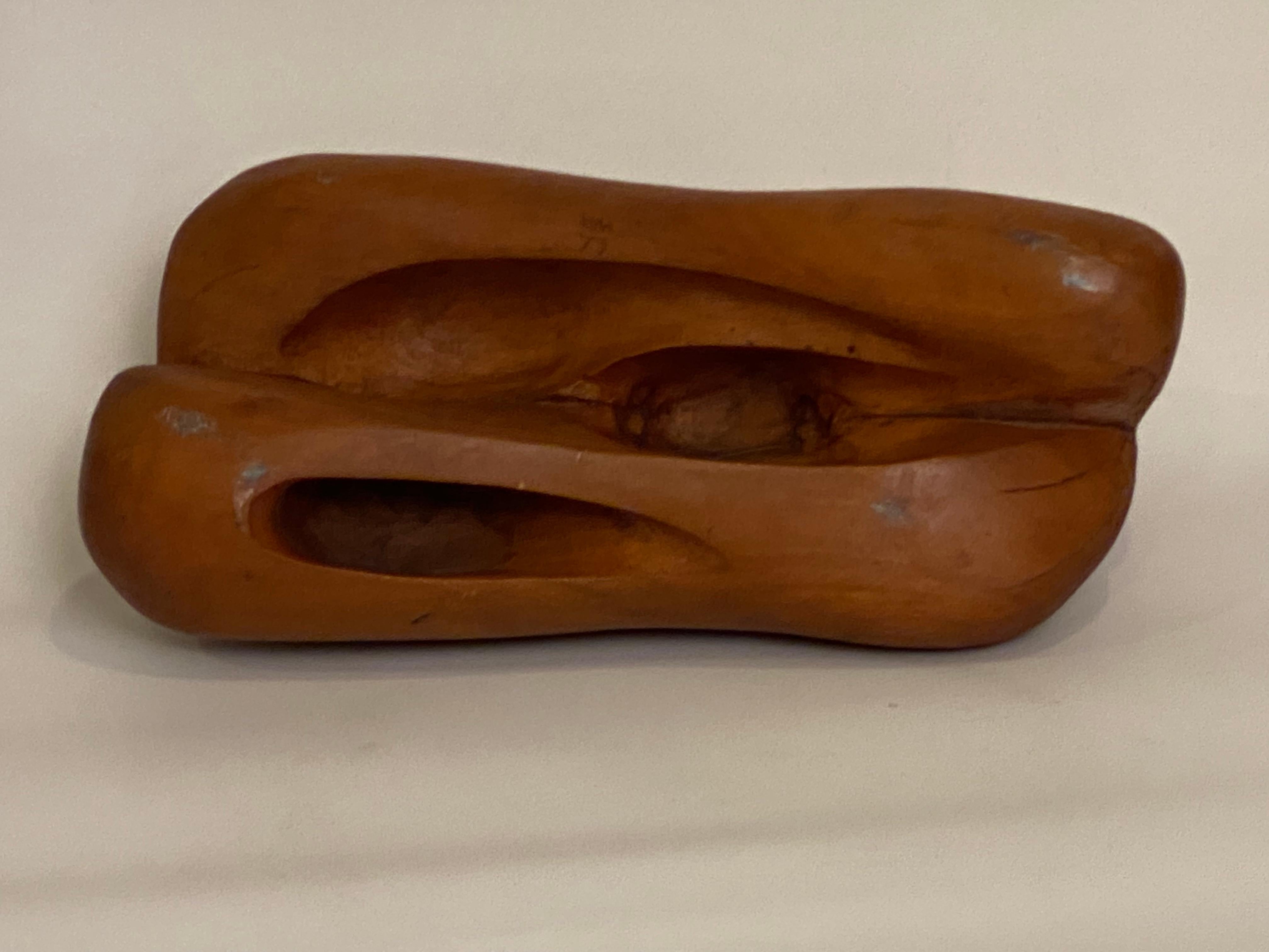 Carved wood free form sculpture, circa 1973. Excellent hand carved solid Maple or Birch Organic Modern abstract sculpture. The artist has rendered open spaces and pierced areas to create intriguing affects of shadowing, contrasts of light and dark,