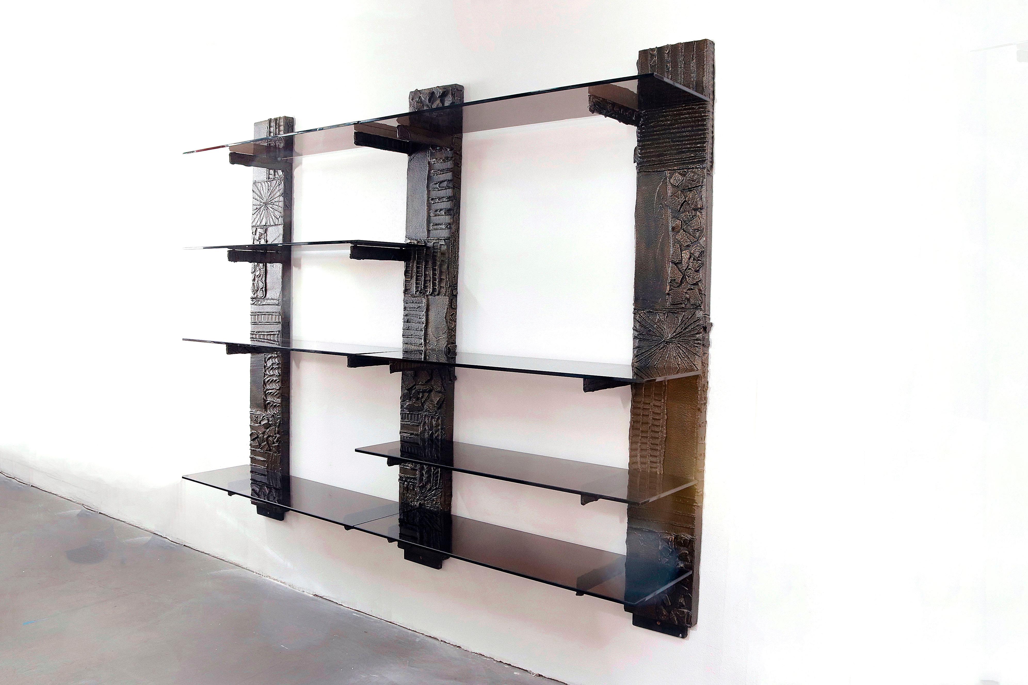 Brutalist wall unit by Paul Evans Studio for Directional USA, 1970's. Bronzed resin over wood with 8 smoked glass shelves. Signed PE 73. Each shelf is 48