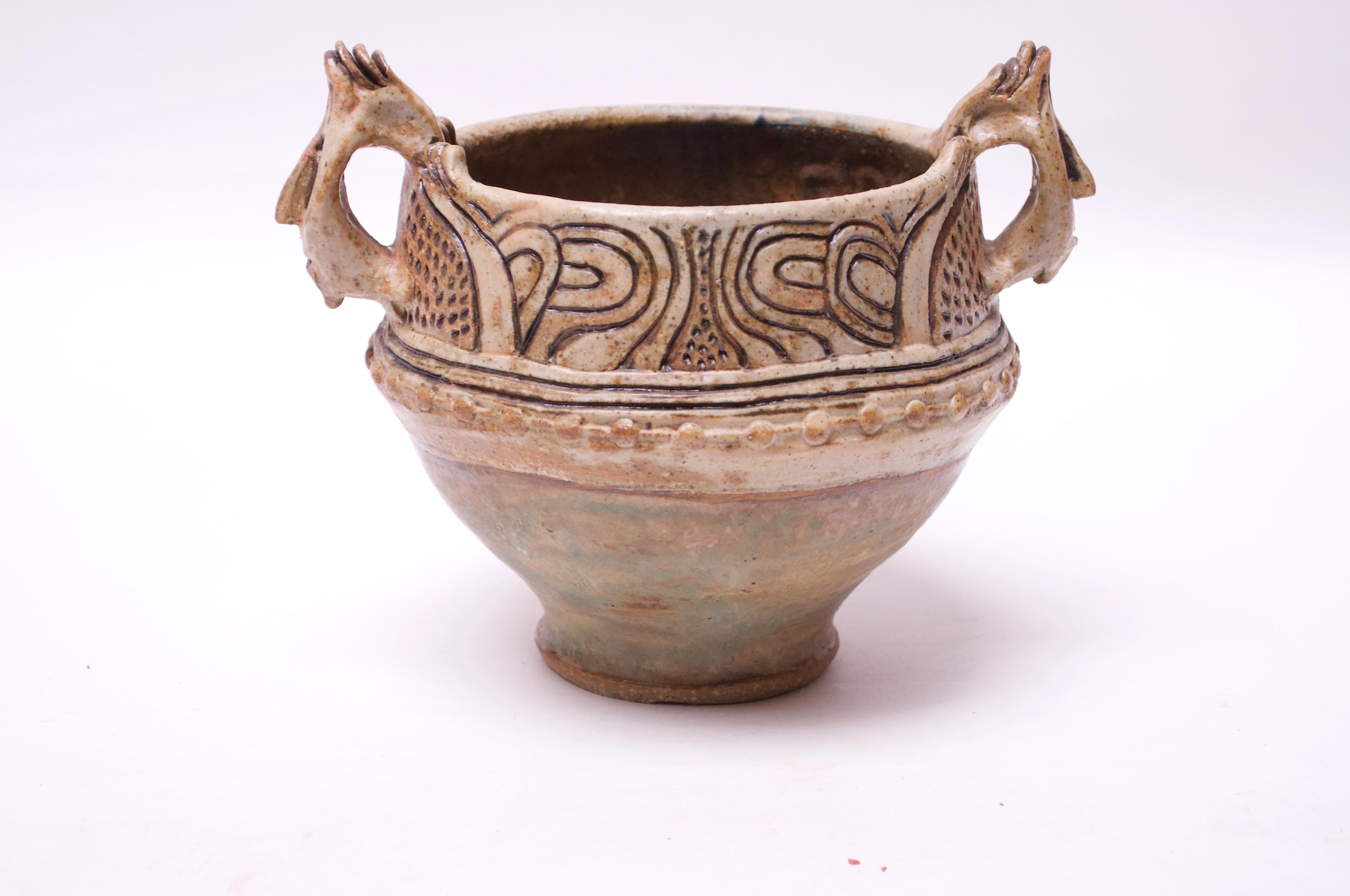Stoneware Amphora in muted palette with pops of green to the lower portion. Sgraffito pattern present along with applied 