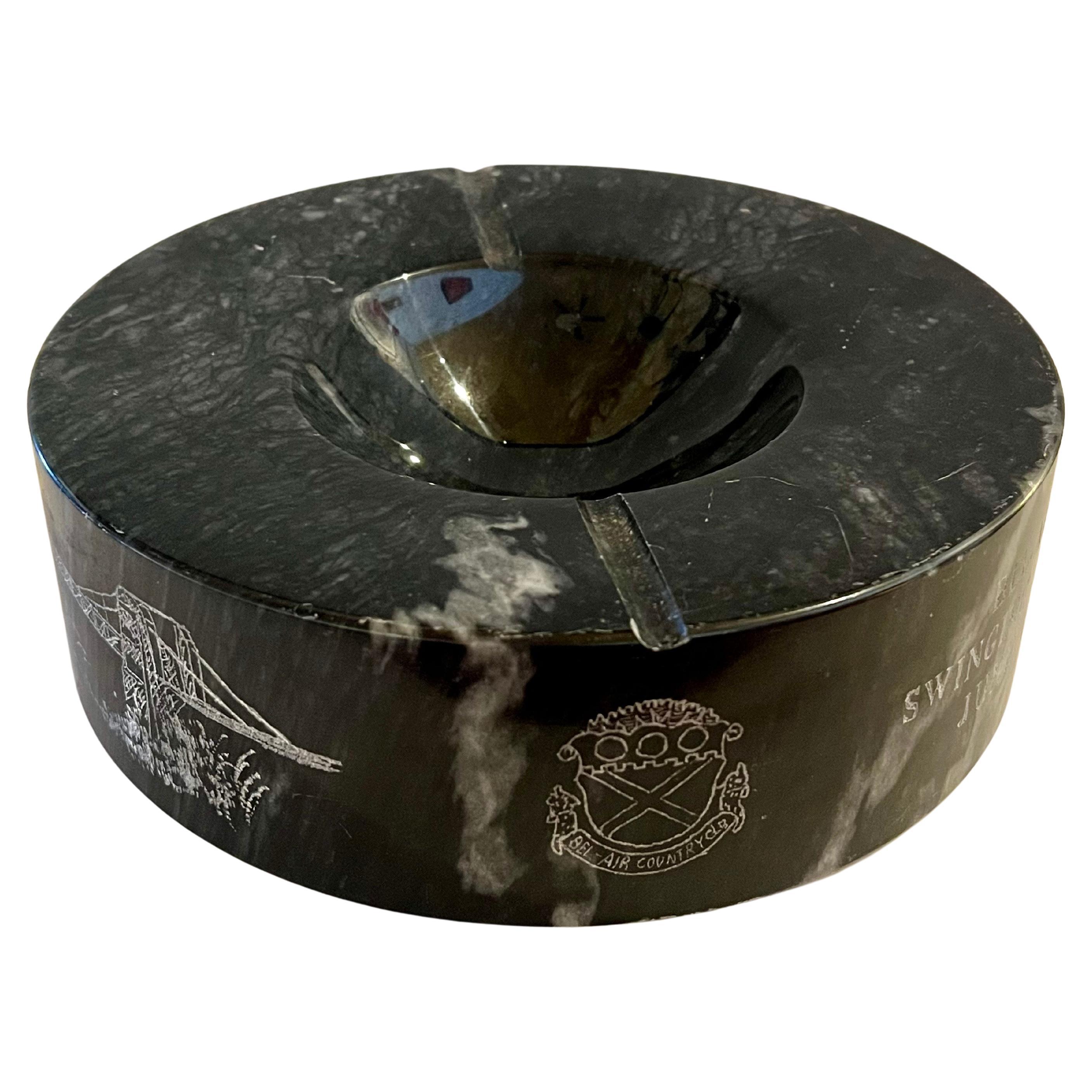 An incredible solid italian Marble ashtray , catch it all bowl , heavy excellent condition no chips or scratches with beautiful etchings from the Bel Air swinging bridge , dated 1974 excellent for the collector of golf memorabillia , a great and