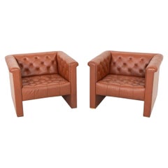 1974 Pareja de sillones Nicos Zographos CH.33 Club Lounge de cuero coñac