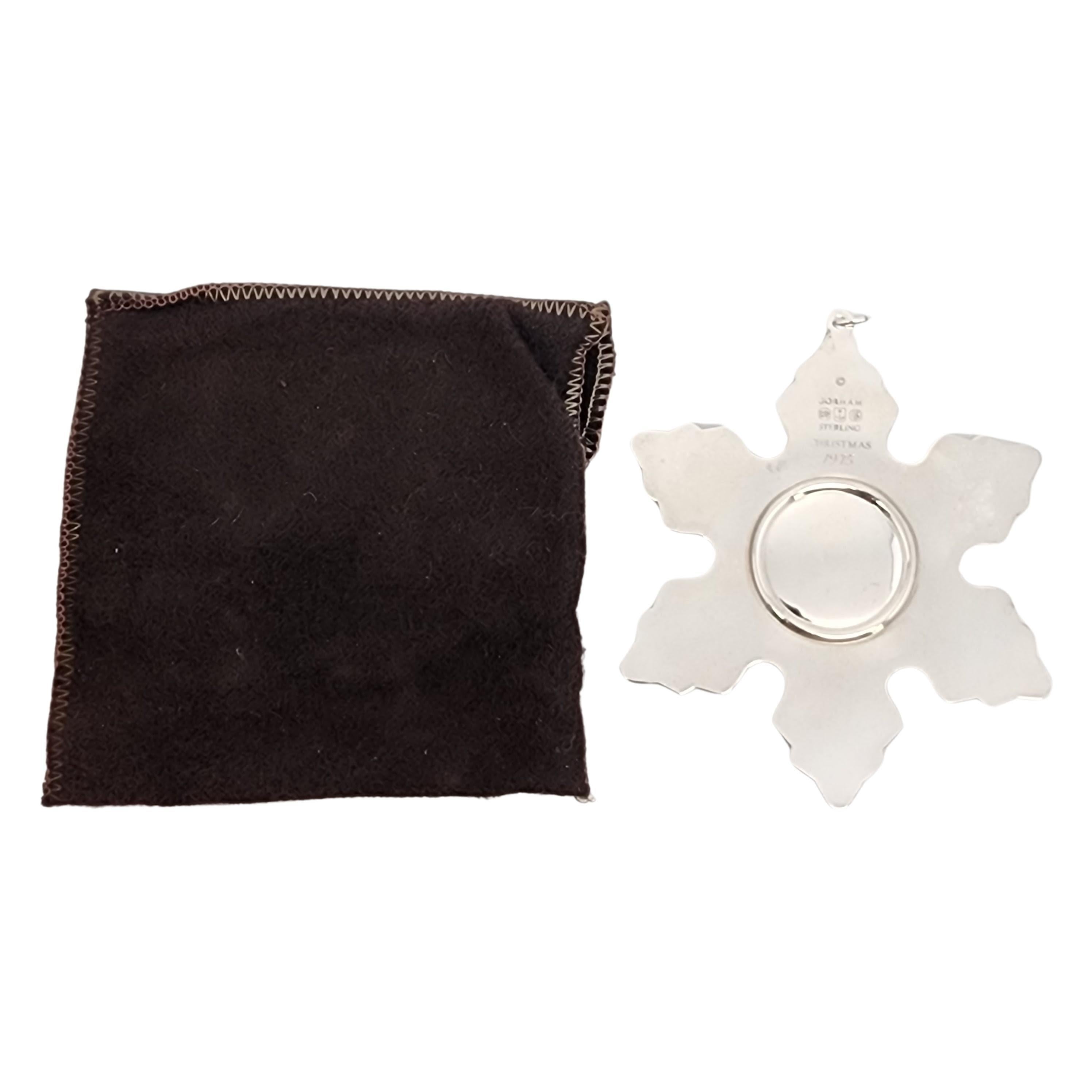 Gorham sterling silver snowflake ornament from 1975 with pouch.

Since 1970, Gorham has been celebrating the season with a yearly version of the classic snowflake form, creating a beautiful tradition of sparkling art. Includes original Gorham felt