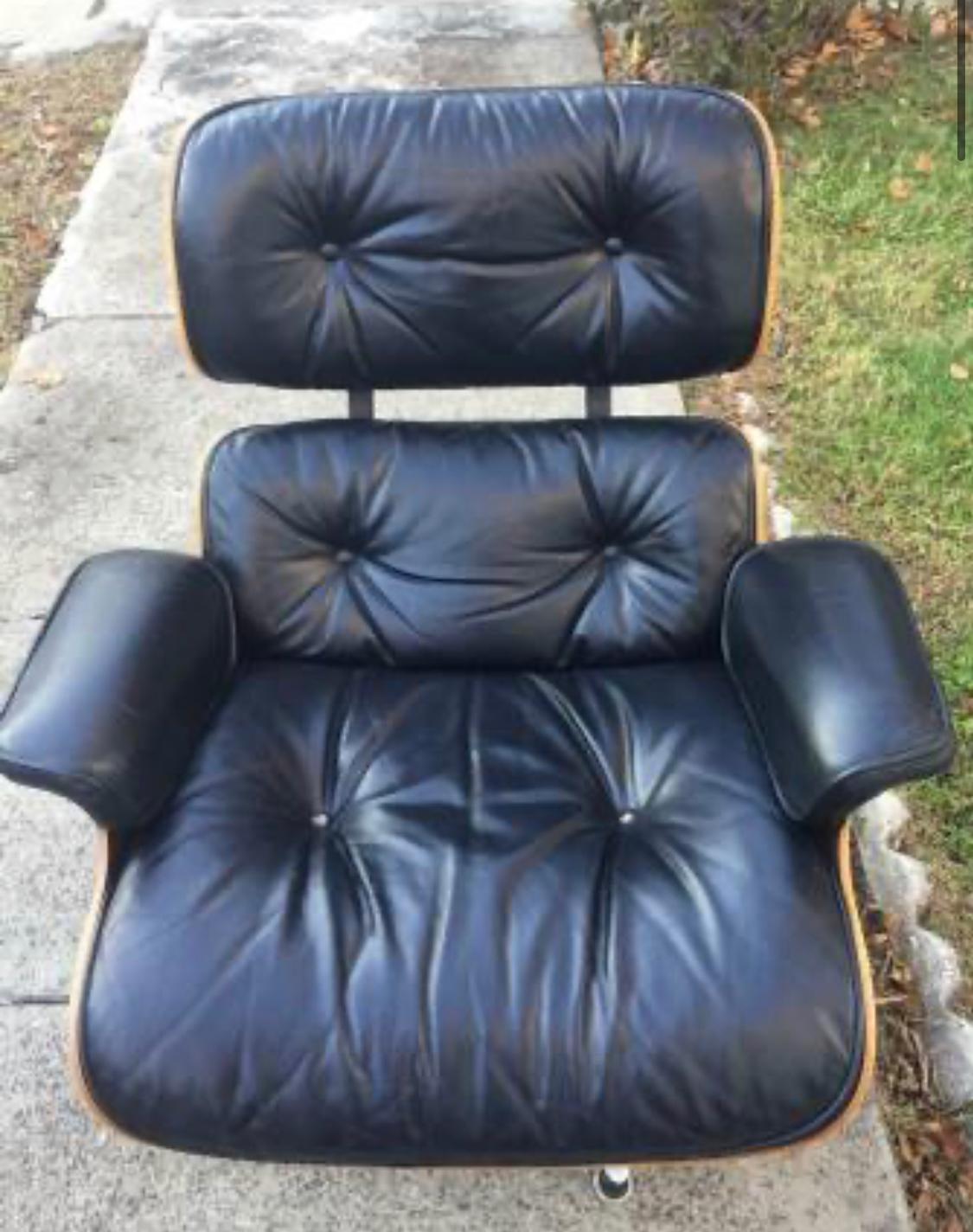 Gorgeous vintage classic Herman Miller Eames lounge chair and ottoman. Signed on chair and ottoman. Lovely wood grain texture and vibrant color. Leather in great shape.