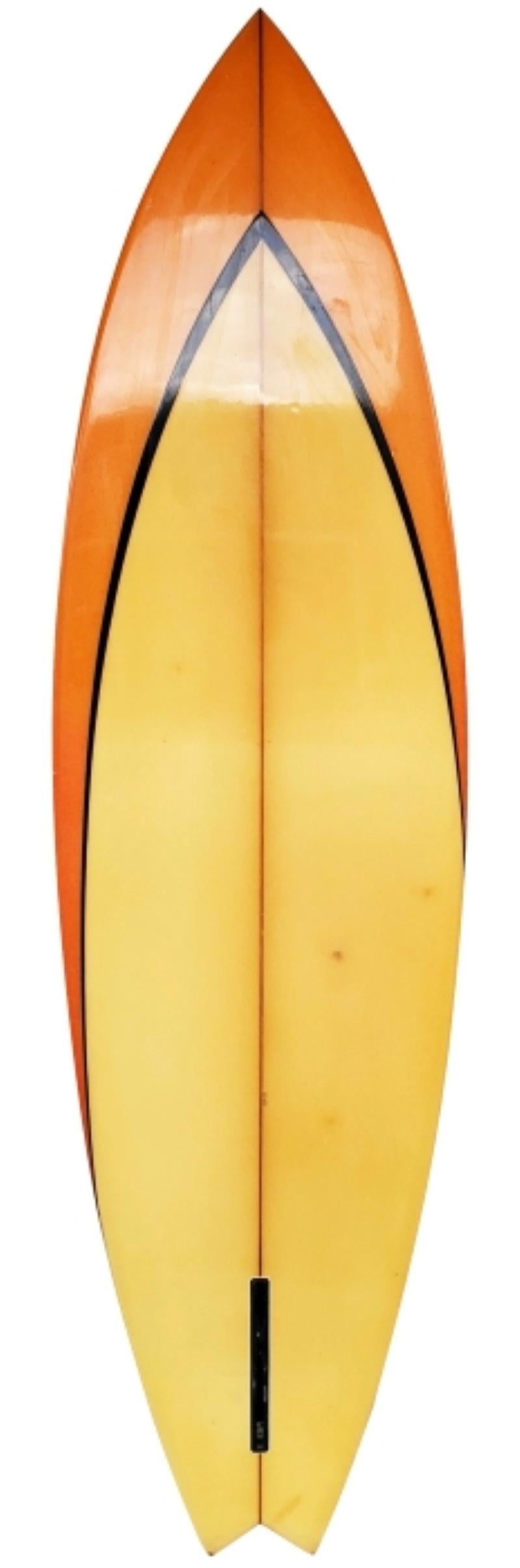 Vintage 1975 Hawaiian expressions single fin surfboard shaped by Larry Bertlemann. Features an orange airbrush design with black pinstriping and original red and yellow box single fin. Uncommon misspelling of Bertlemann's last name with only one 