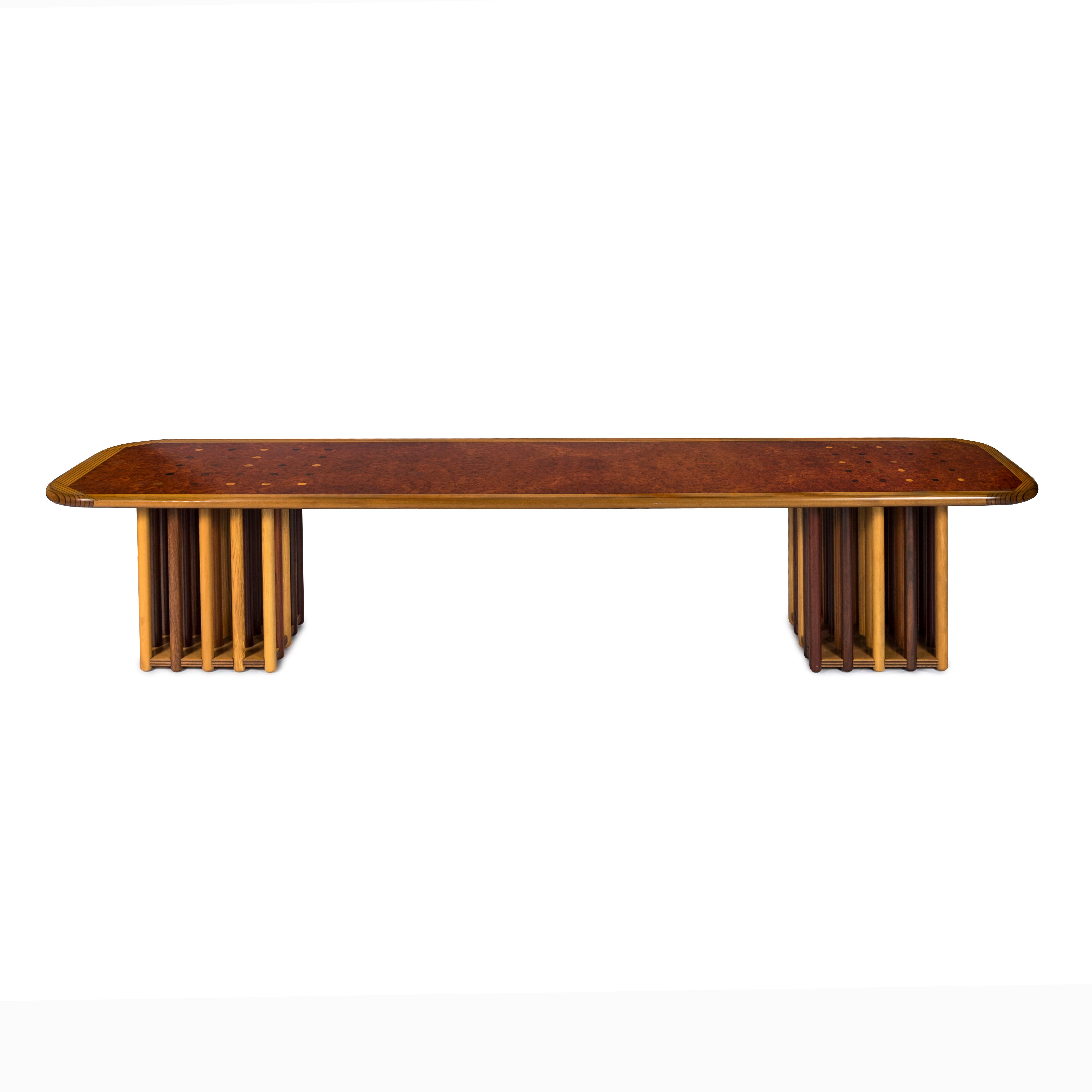 The Afra & Tobia Scarpa coffee table stands as a masterpiece in the realm of furniture design, epitomizing the fusion of aesthetic brilliance and functional ingenuity. Crafted from a harmonious blend of Maple Burl, Birch, Beech, Oak, and Fruitwood,