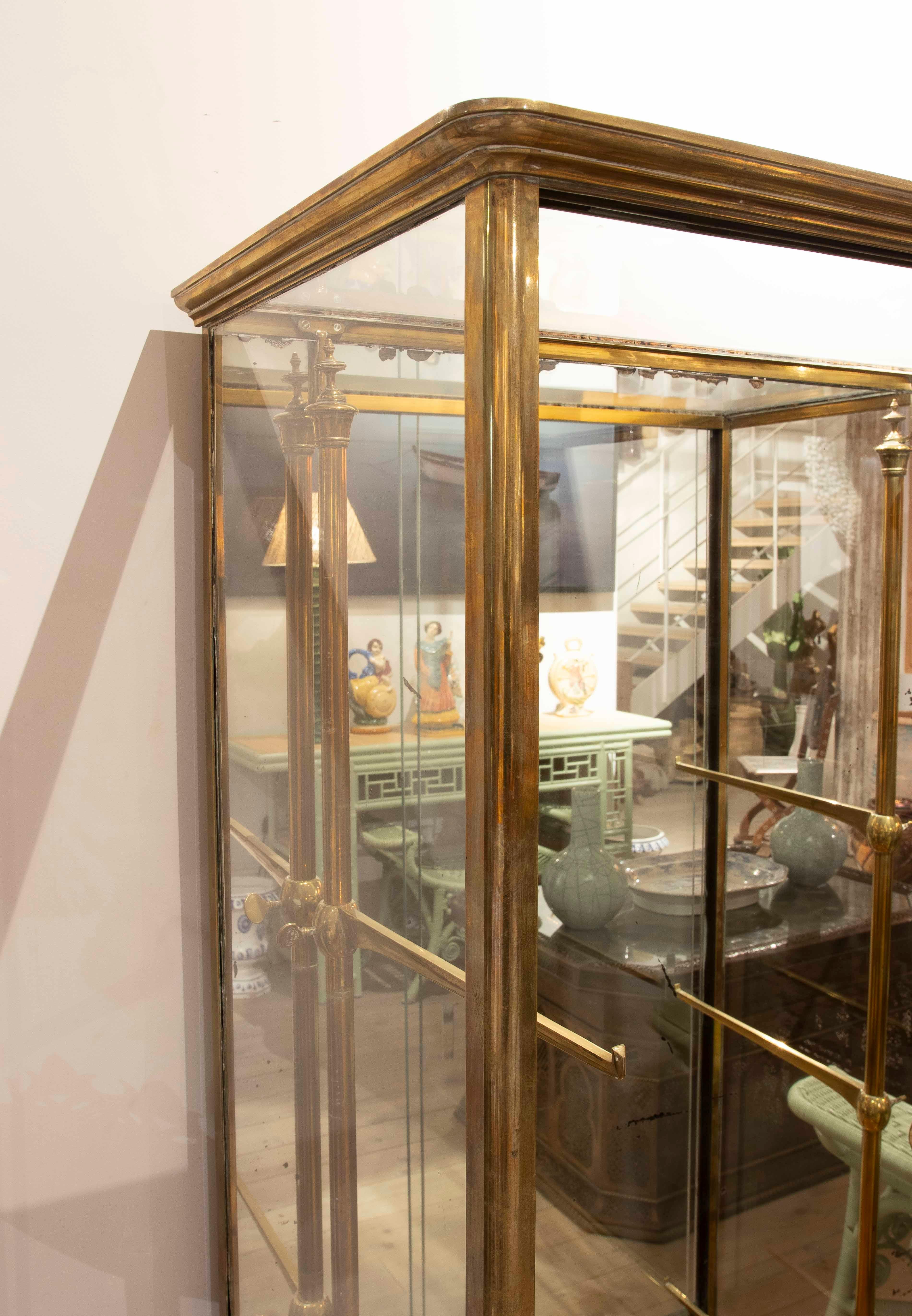 Bronze, wood and glass pastry case of the nineteenth century. Paris, 80 Rue Orfila, France.