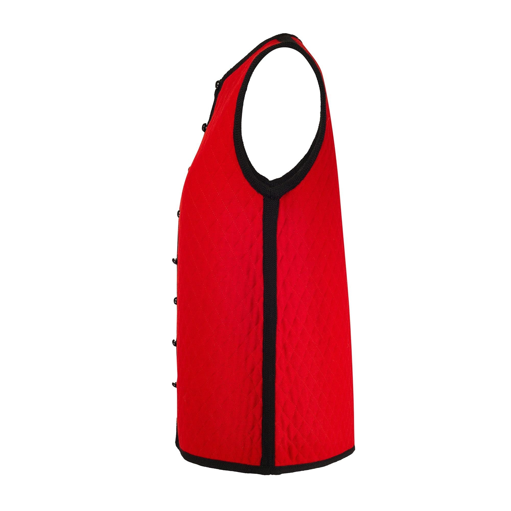 This vibrant red gilet jacket was created by Yves Saint Laurent for the brand’s beloved Fall 1976 collection and for his Rive Gauche label, a reference to Paris’s younger and trendier left bank. The ready to wear collection echoed the haute couture