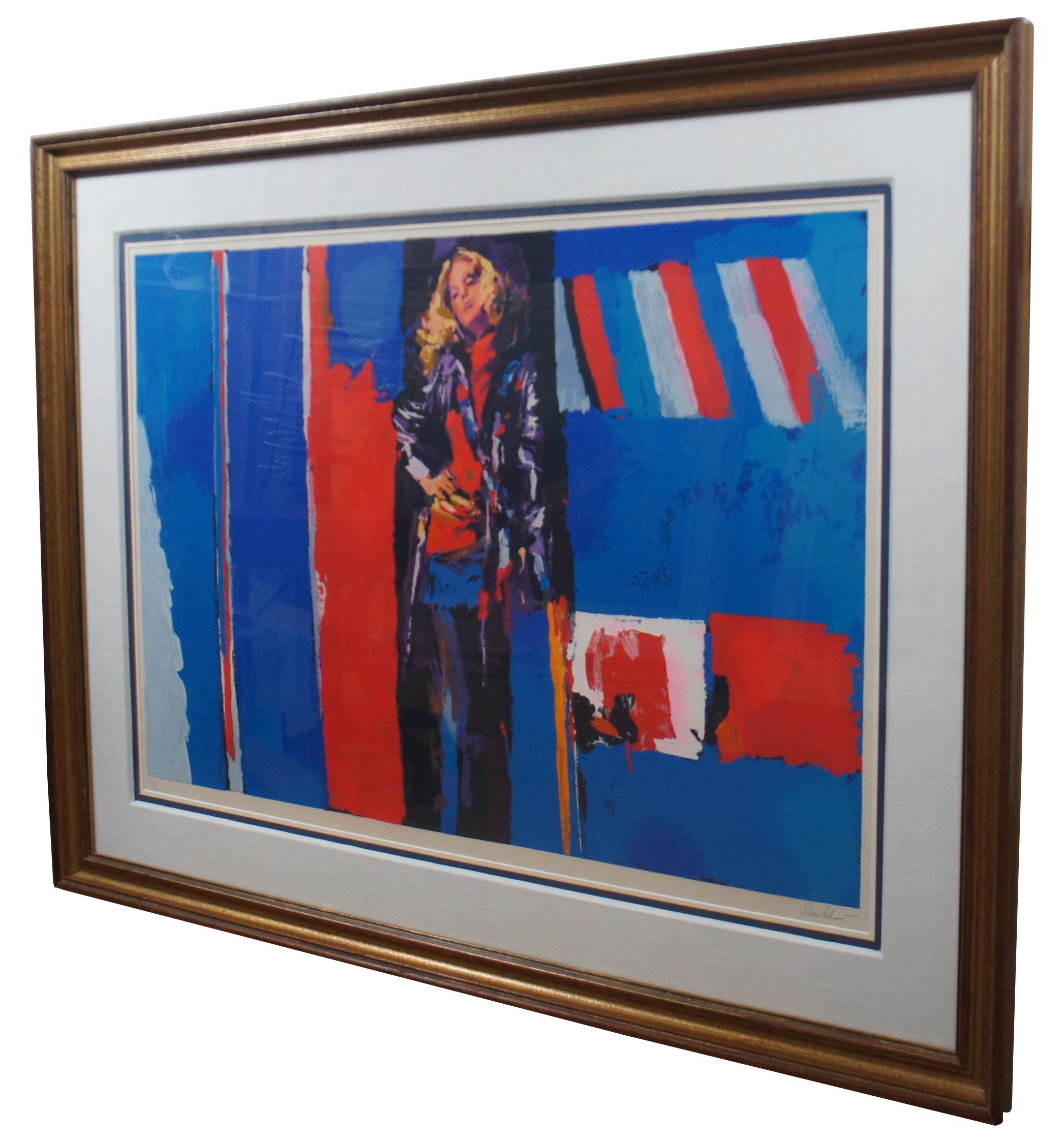Vintage 1976 limited edition serigraph print by Nicola Simbari titled “Nanette,” showing a blonde woman posed in front of a red, white and blue backdrop; pencil signed and numbered 243/300. “Nicola Simbari is a painter of semi-abstract impressionist