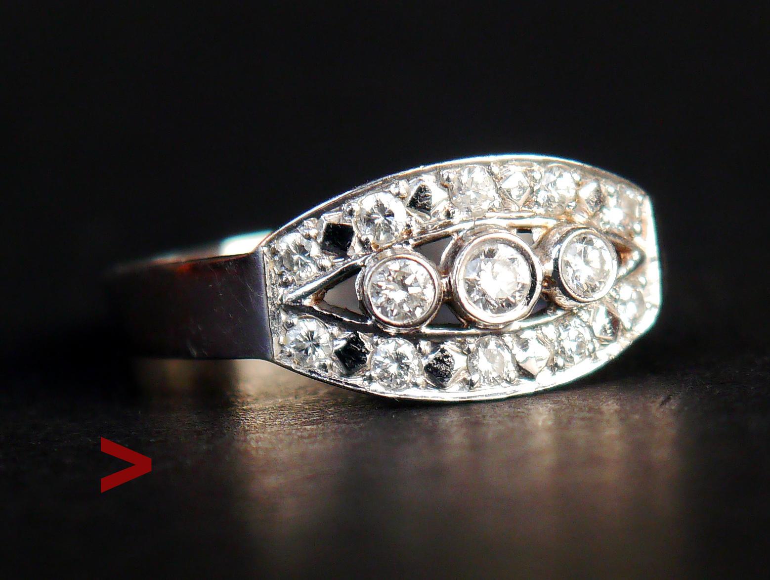 Vintage Ring in solid 18K White Gold decorated with Diamonds.

Made in Sweden, Marked 18K; maker's hallmarks ,city of Stockholm; Year marks: B10 =1976

13 bezel and pave set diamond cut Diamonds Color circa F,G ; VS . with total weight circa 0.34 in
