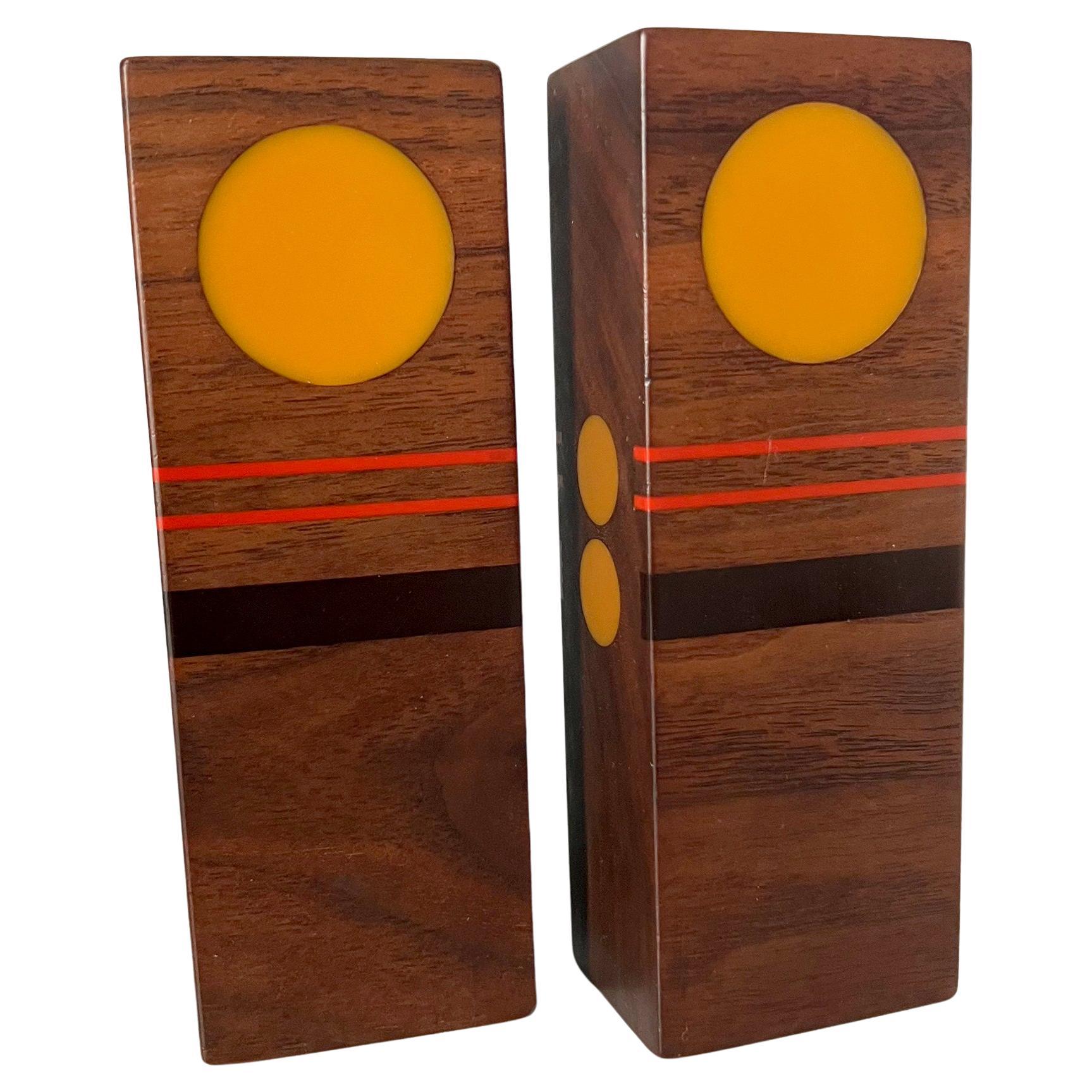 Handcrafted teak wood and resin salt and pepper shakers by  Robert McKeown of California, circa 1976. Shakers measure.5.25