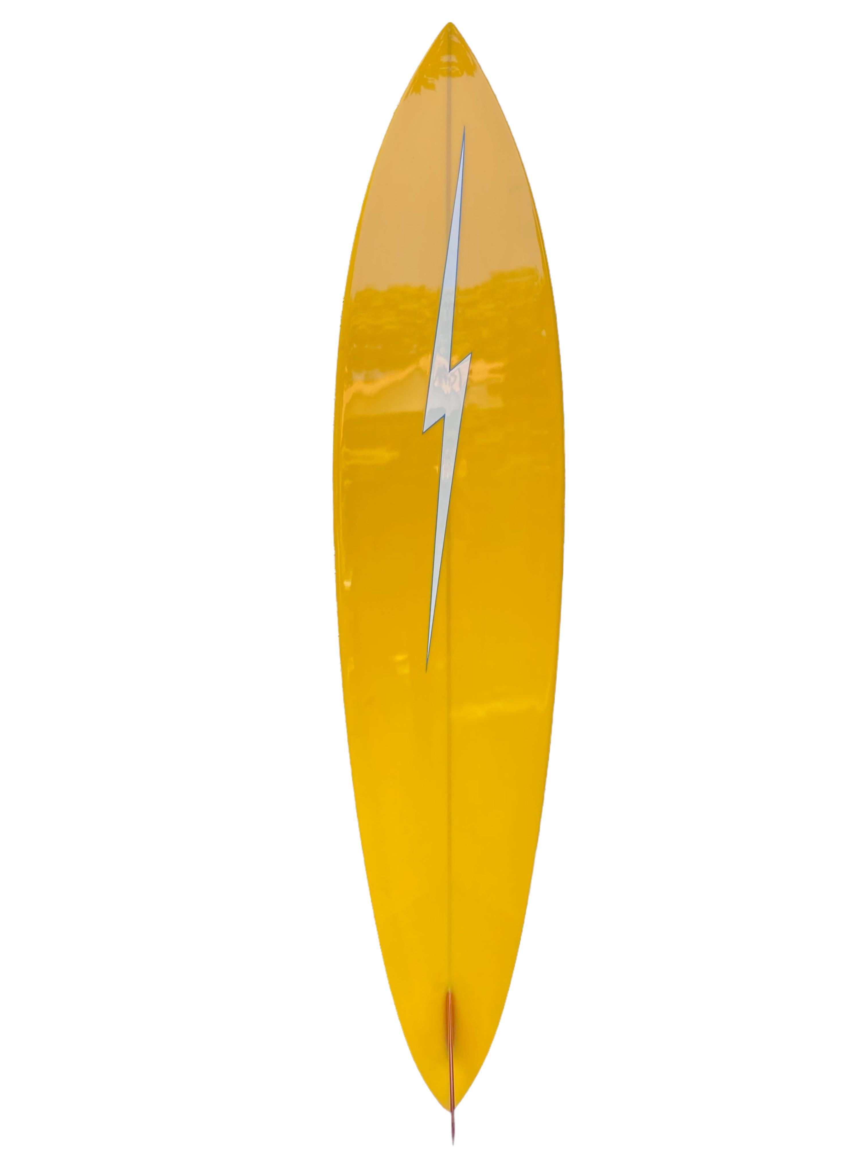 1976 Lightning Bolt surfboard shaped by Pat Rawson. Features a beautiful orange/yellow color scheme joined by a double pinstriped outline. Pintail shape design with glassed-on single fin. A remarkable example of a highly sought after vintage 1970s