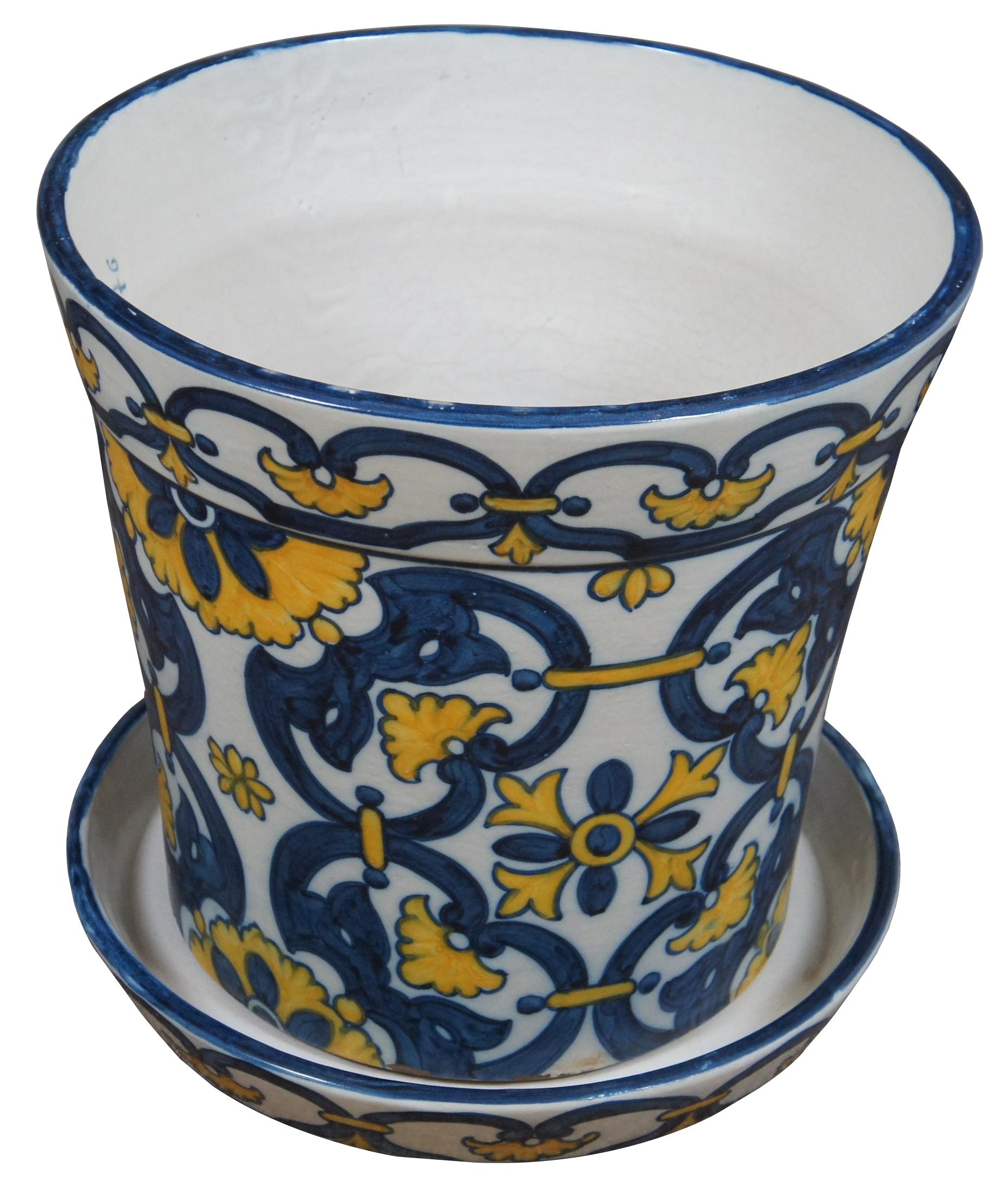 Vintage hand crafted Sant’Anna Portuguese pottery, very large flower pot or planter and underplate in white decorated with blue and yellow floral designs, made in 1976. “Sant’Anna is a Portuguese ceramic factory, established on 1741, that produces