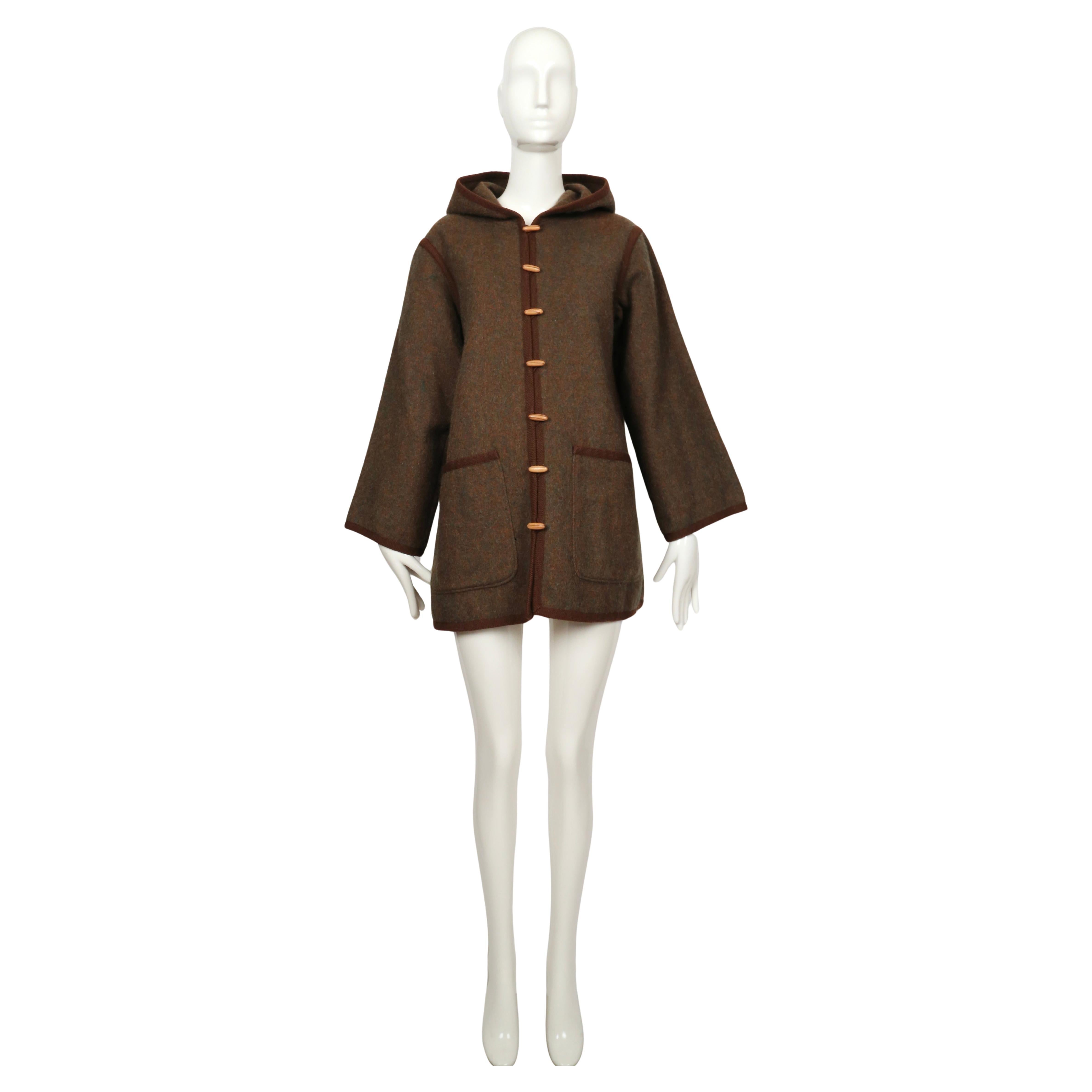 Yves Saint Laurent, Fall 1976

A rustic hooded jacket from Yves Saint Laurent’s celebrated Fall 1976 “Ballet Russes” runway collection. Made in a mottled brown wool, the jacket features an unstructured, relaxed silhouette with wide sleeves and patch