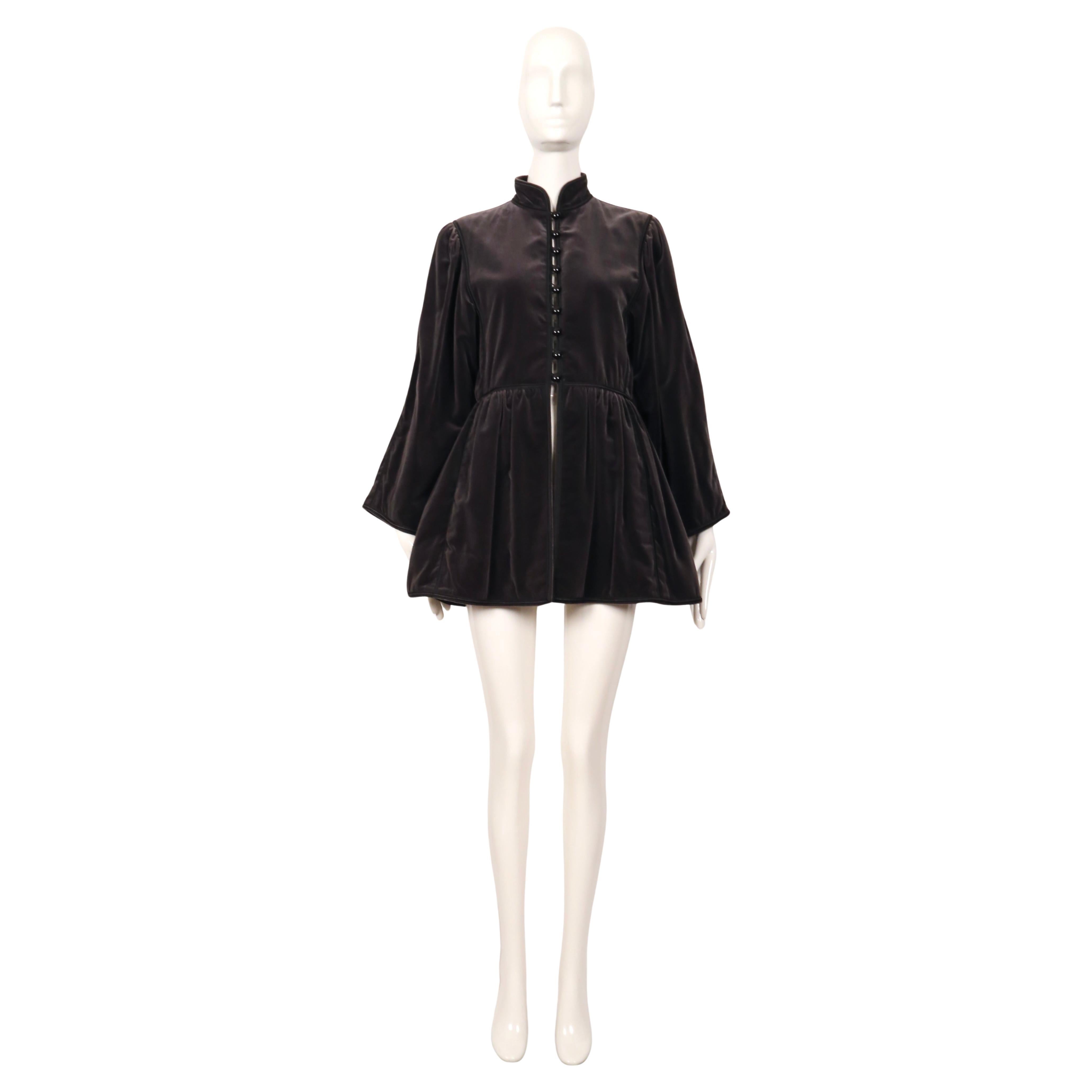 Very rare, dark grey velvet coat with fitted bodice and full sleeves designed by by Yves Saint Laurent dating to fall of 1976 from the well documented 'Ballets Russes Opera' Collection. Labeled a French size 42 (fits very small). Approximate