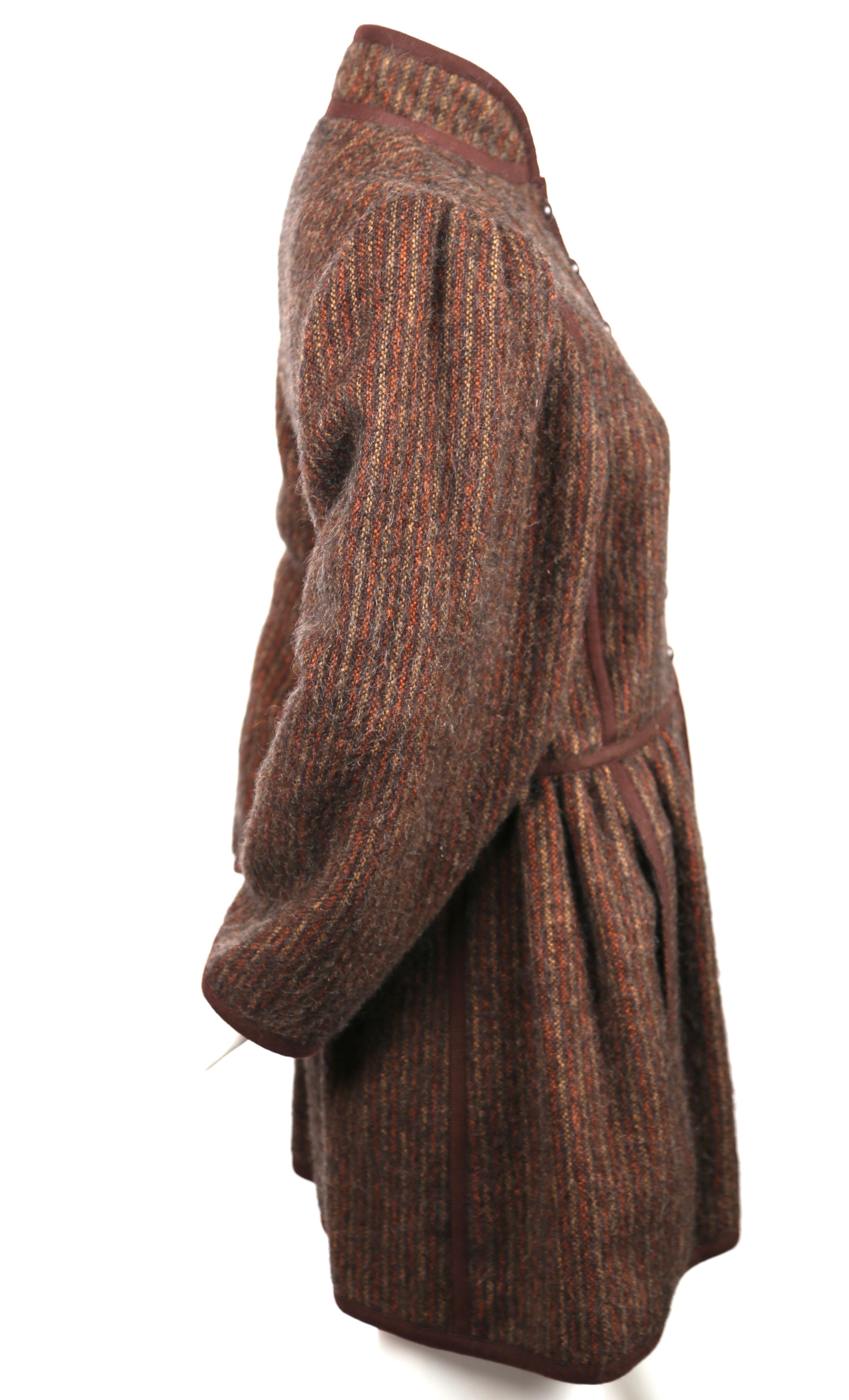 Very rare wool striped coat with fitted bodice and full sleeves by Yves Saint Laurent dating to fall of 1976 from the well documented 'Russian Collection'. Labeled a French size 34 however this can also fit a FR 36 or US 2-4. Approximate