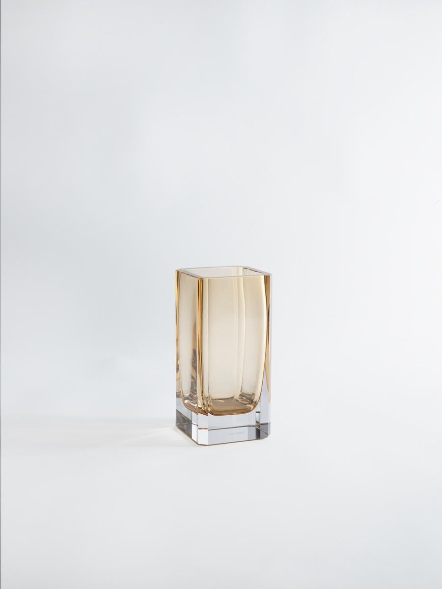 With their clean, minimalist lines, faceted corner detail and sultry colours.

Greg Natale’s new 1977 vases will make a sophisticated addition to any room.
The vases are part of the Greg Natale Nightlife collection and their name is layered with