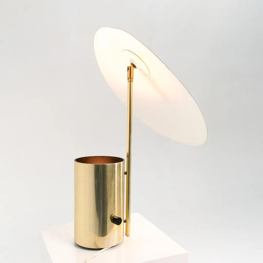 This is an uncommonly seen Half-Nelson reflector table lamp, designed by George Nelson and manufactured by Koch & Lowy in the late 1970s. This design was initially created ca. 1949-1950, but the silhouette was not reproduced until 1977 when Nelson