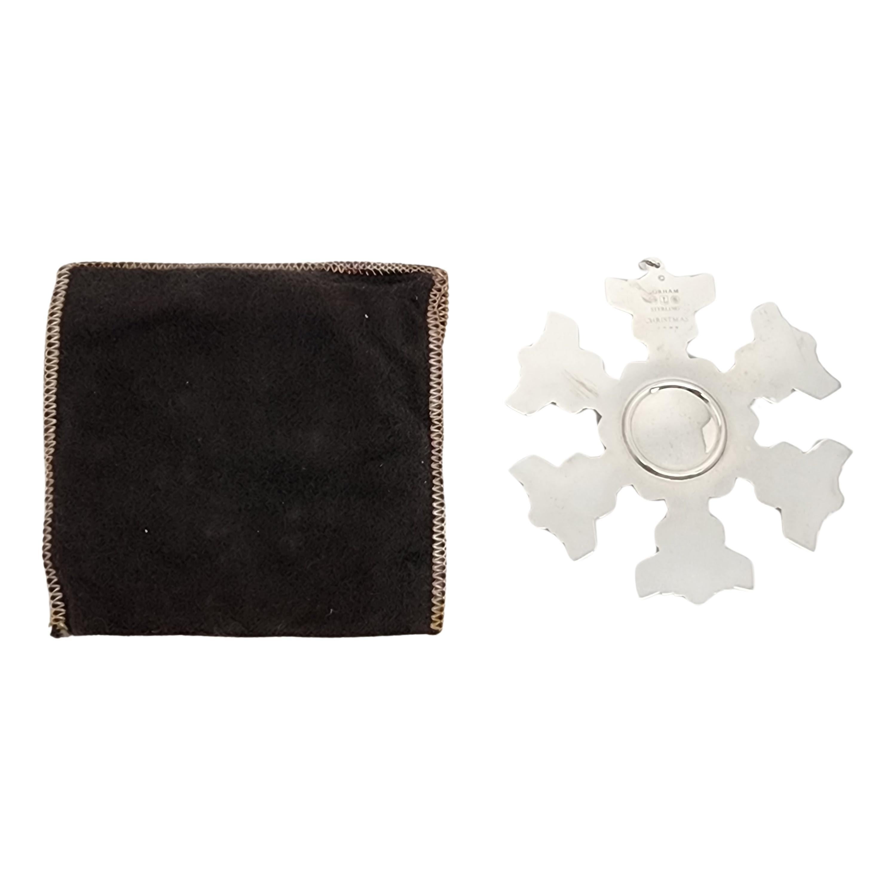 Gorham sterling silver snowflake ornament from 1977 with pouch.

Since 1970, Gorham has been celebrating the season with a yearly version of the classic snowflake form, creating a beautiful tradition of sparkling art. Includes original Gorham felt