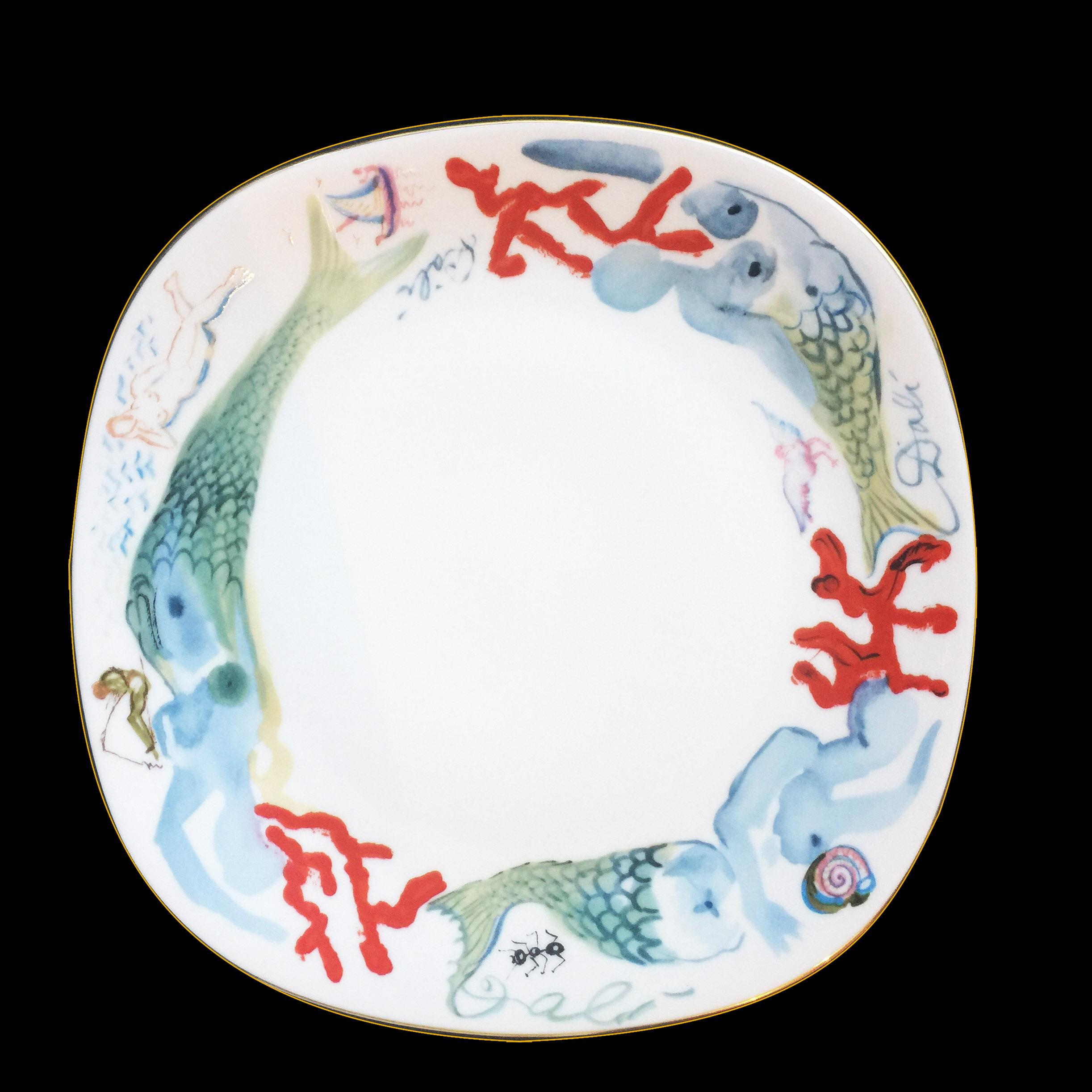 Salvador Dalí (1904-1989) world famous Spanish painter, graphic artist and sculptor of surrealism designed this ceramic edition painted porcelain with 24-karat gold trim, complete dinner service for 12. 
Plate signed; on front and back, and numbered