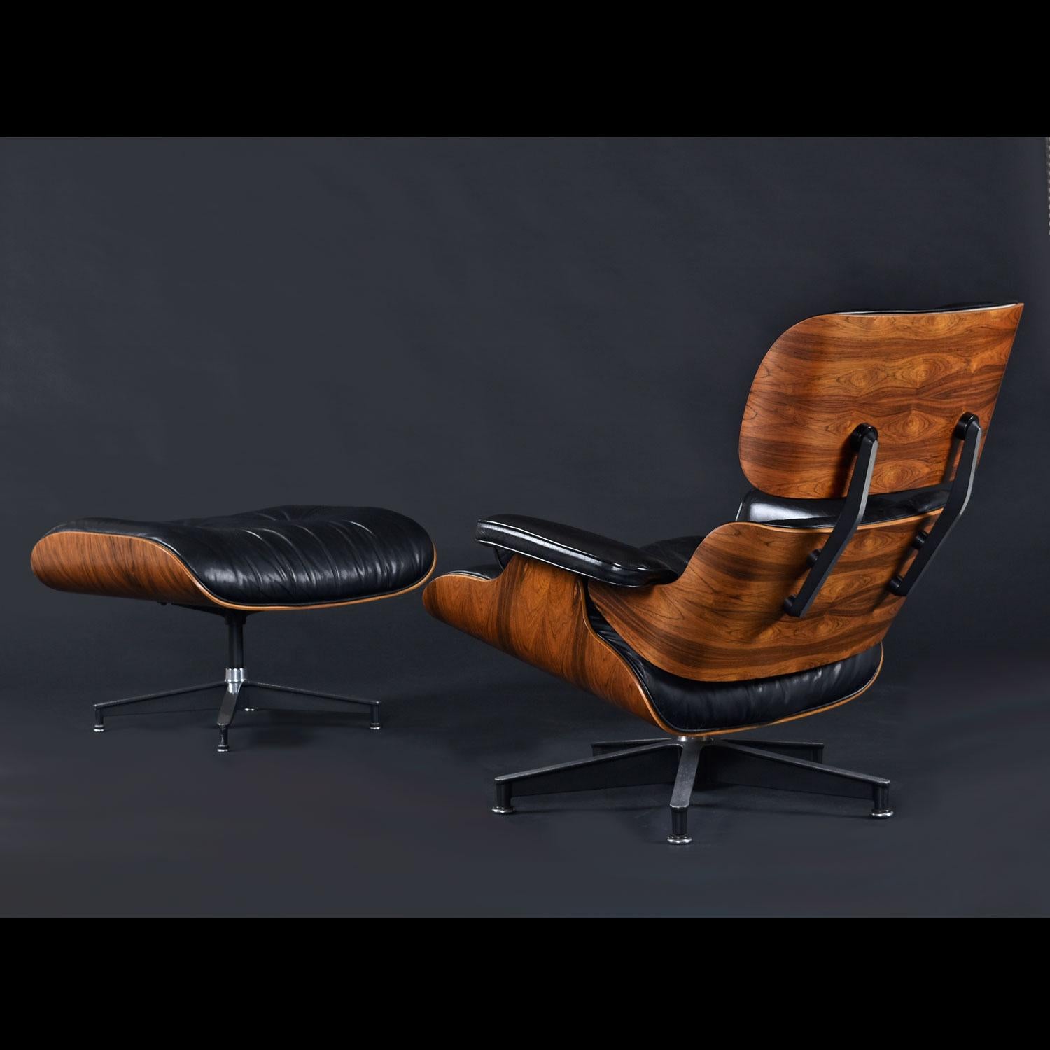 100% Original, right down to the base glides. Born on Oct 17, 1977, this pair has remained in its original glory for 45 years. This classic Eames recliner is available today in many wood finishes, however rosewood is no longer offered on new chairs