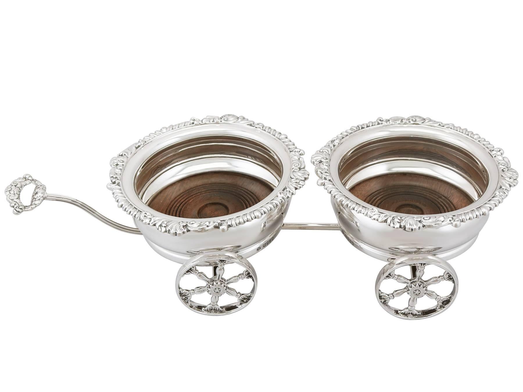 An exceptional, fine and impressive pair of vintage English sterling silver carriage coasters; an addition to our range of collectable silverware.

These exceptional vintage sterling silver carriage coasters have a circular rounded shaped