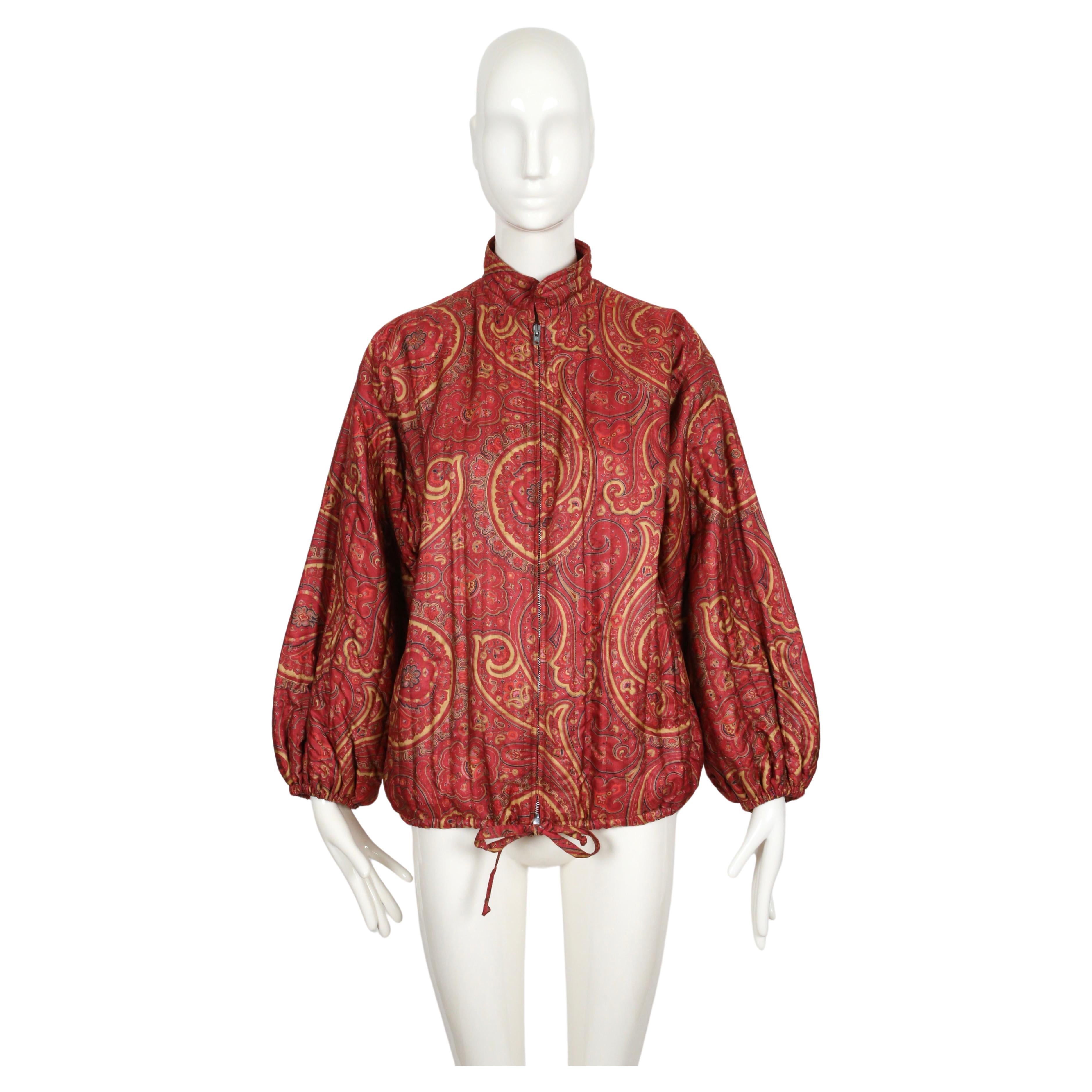 Paisley printed, quilted silk jacket from Yves Saint Laurent dating to spring of 1977 as seen on the runway. Great transitional piece. French size 40. Fits oversized. Zip closure. Pockets at hips. Fully lined. Made in France. Excellent condition. 