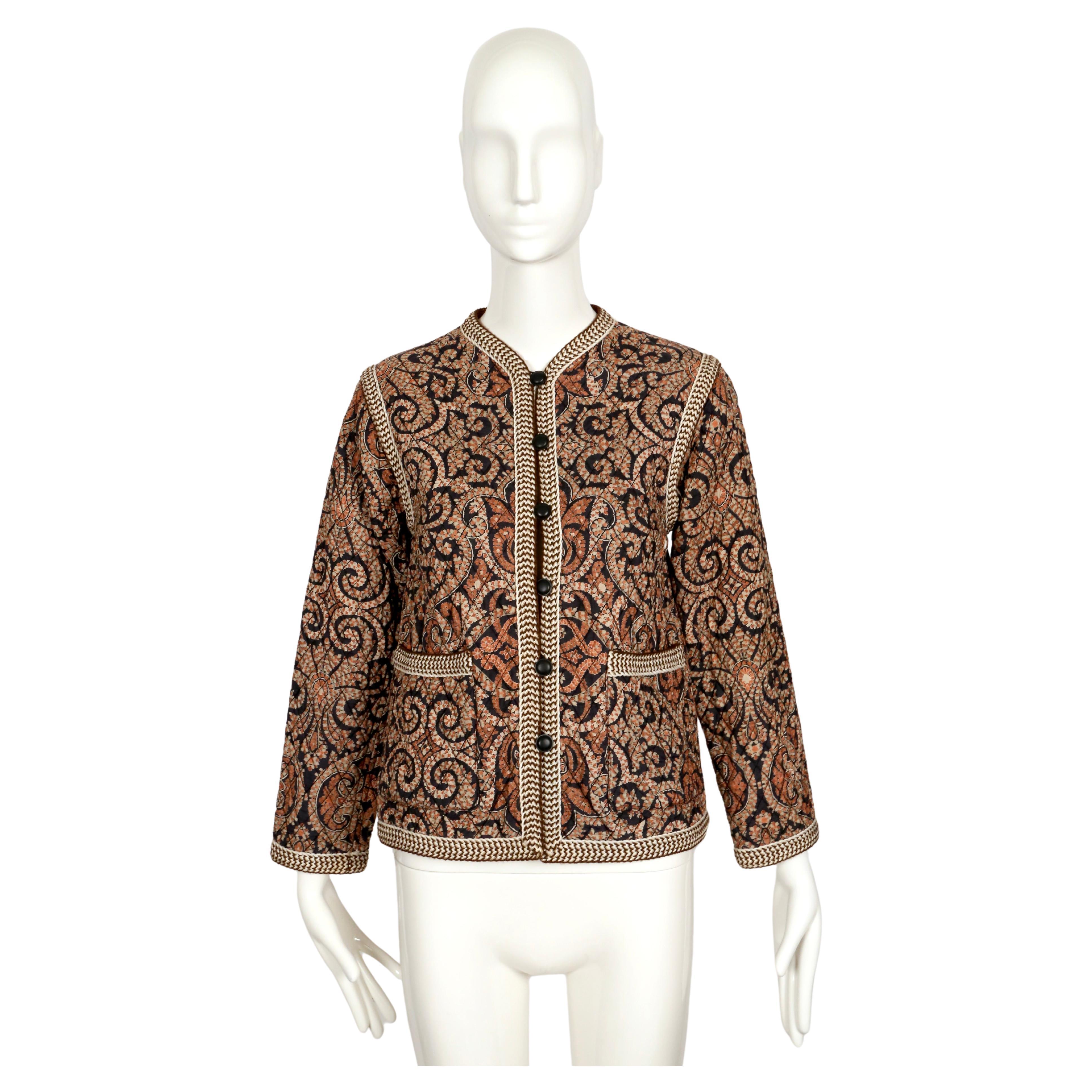 Very rare and striking, Batik printed, silk quilted peasant jacket with 7 button closure and black trim from Yves Saint Laurent dating to 1977. There is no size label however it best fits a size 2 or petite 4 (photographed on a size 2 mannequin).