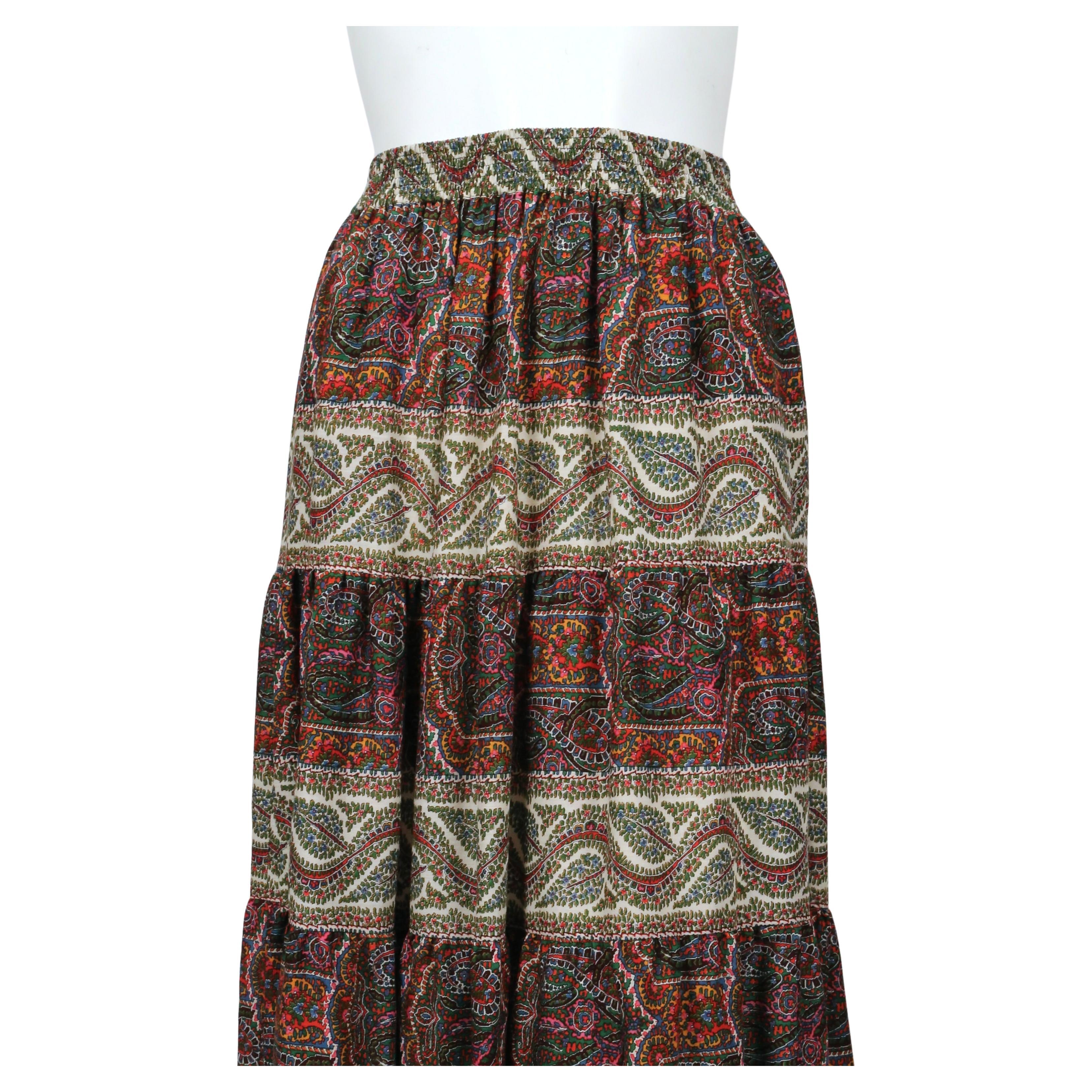 Floral and paisley printed wool challis tiered skirt designed by Yves Saint Laurent dating to 1977 as seen in the Saint Laurent fall ad campaign. Skirt is labeled a French size 34 however it does have an elastic waist. Approximate measurements: