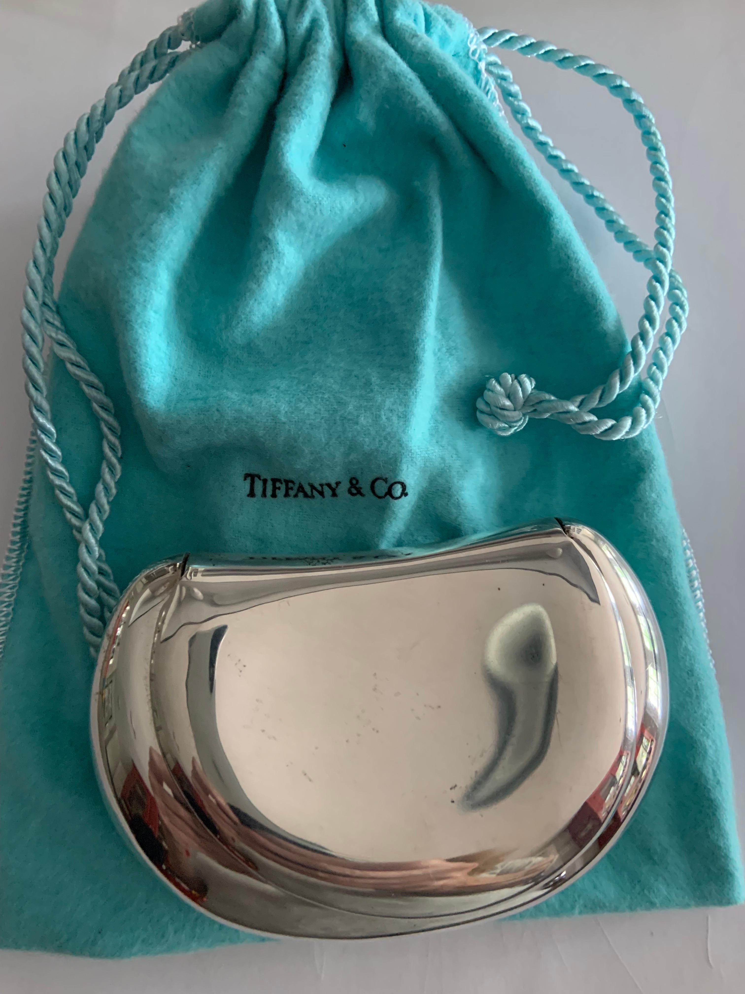 An early design from Elsa Peretti for Tiffany & Co, this stunning sterling silver clutch is so organic, it fits perfectly in the palm of your hand.  The bag is smooth and sleek and just large enough for a lipstick, key and credit card.  It is marked
