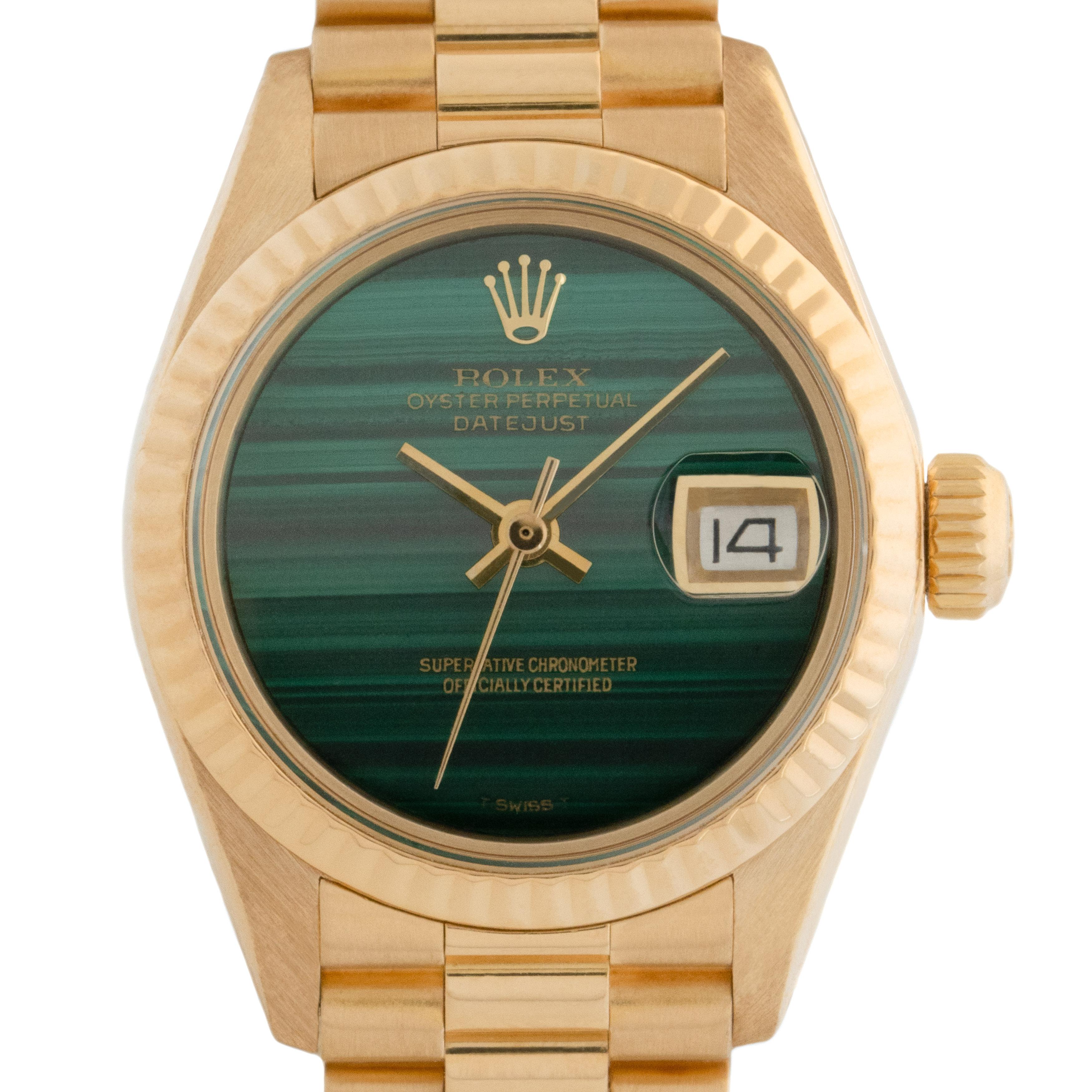 Vintage Rolex 18 Karat Yellow Gold Ladies DateJust with a RARE and original Rolex Malachite dial 
circa 1978
26mm Dial
Automatic movement
Model Ref 6917

Currently fits up to a 6.5