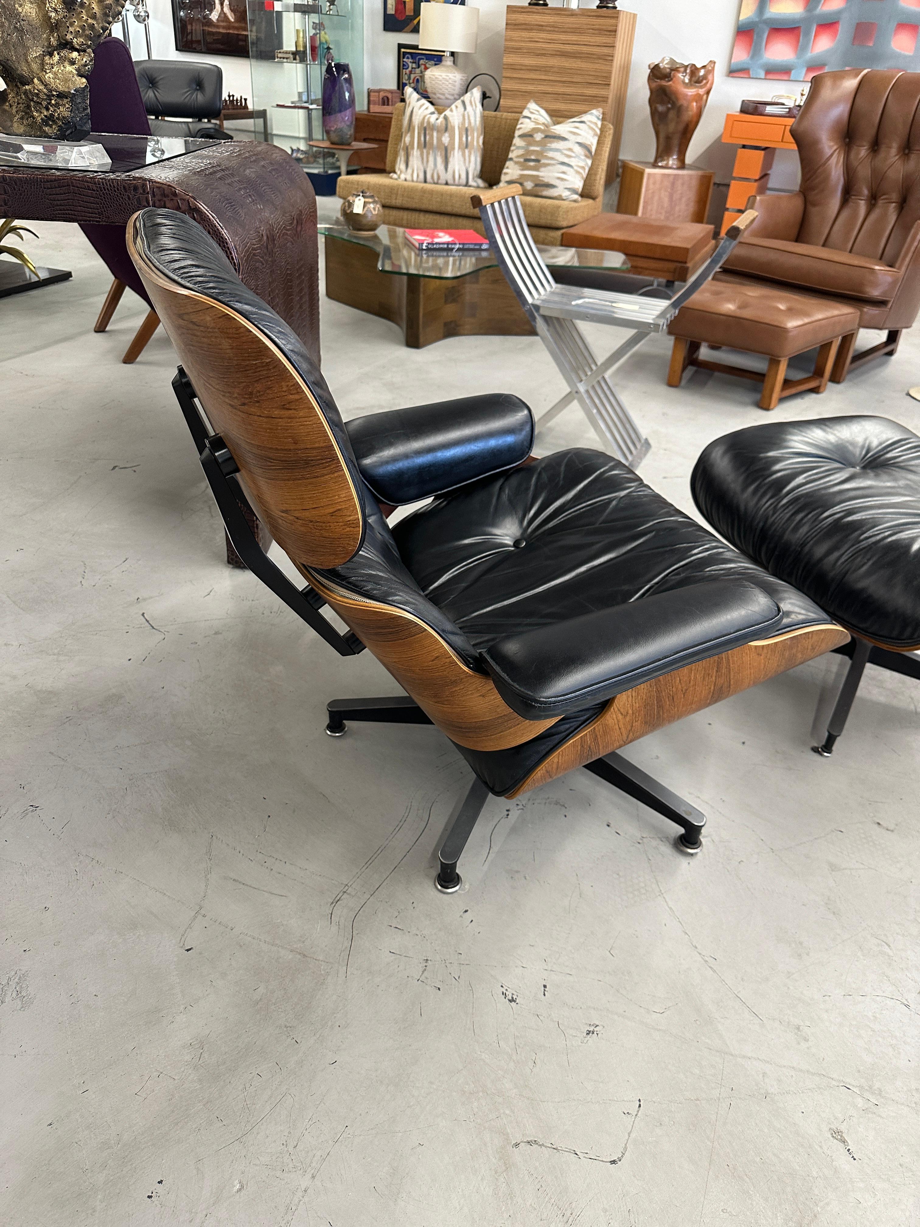 A beautiful vintage rosewood Herman Miller Eames chair and ottoman from the 1978. The chair and ottoman have the down filled cushions and are wonderfully broken in and are extremely comfortable. The chair has the original Herman Miller tag paper