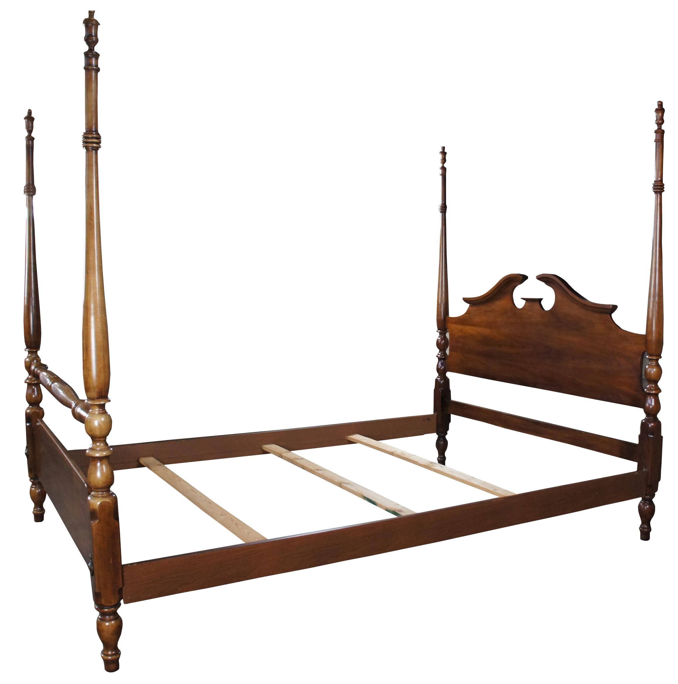 Thomasville Collectors Cherry Georgian Style Queen size four poster bed, circa 1978. Features an open pediment and high turned posts with chamfered corners and trophy finials. Naturally distressed finish. Number 10111- 475, DEO-02-9

Measures: