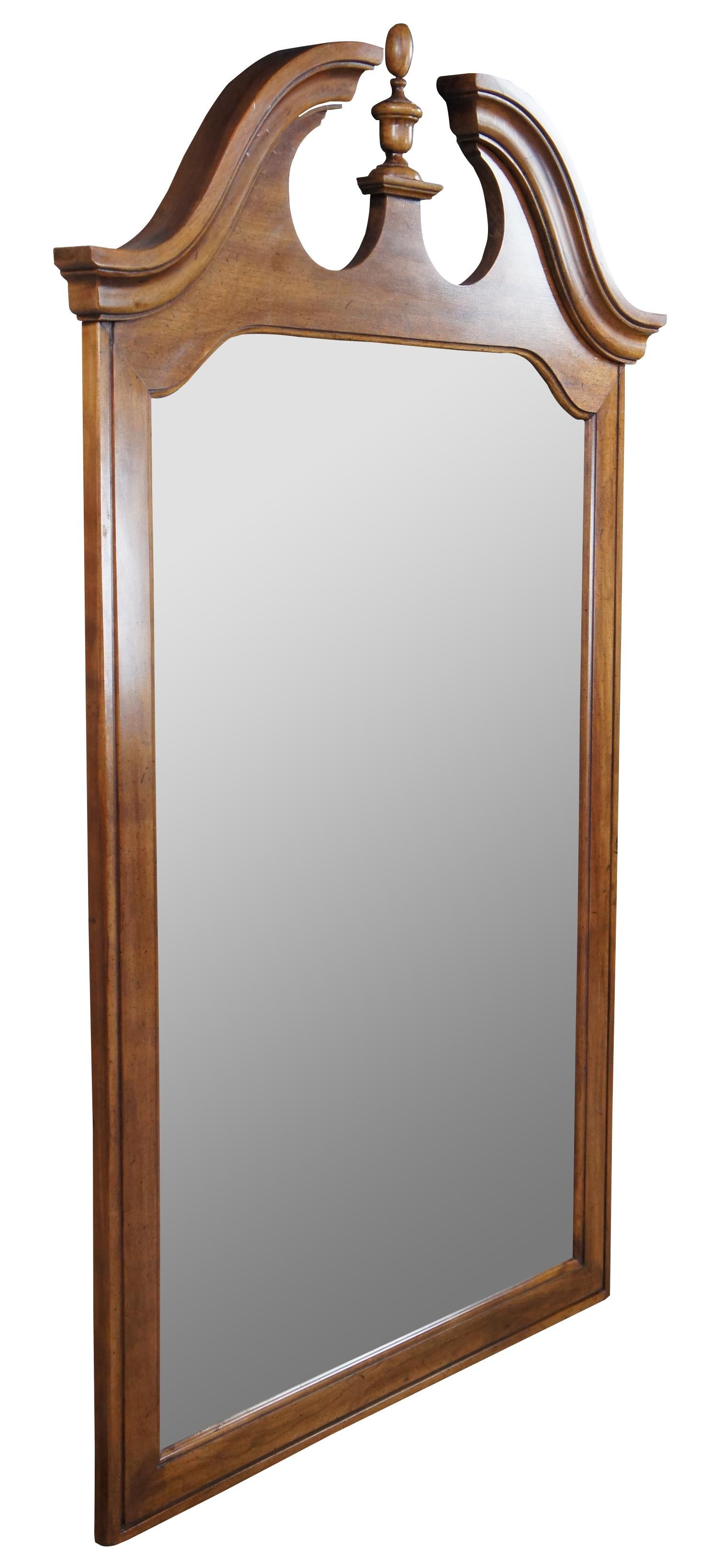 Thomasville Collectors Cherry Georgian style mirror, circa 1978. A tall cherry case with naturally distressed frame and open pediment. Number 10111-220, DR-02-9.
 