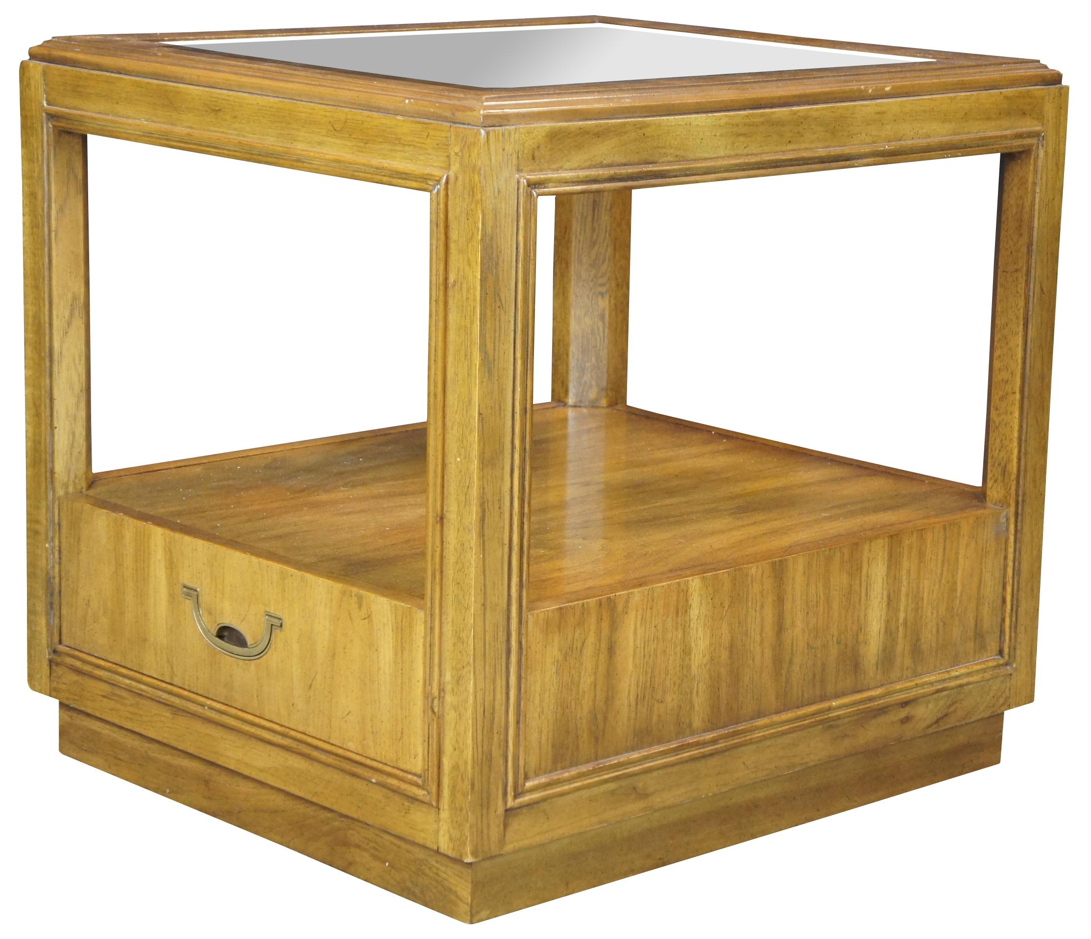 Vintage 1979 Drexel Heritage Accolade II side table. Made of walnut featuring cube shape with two tiers, glass top and storage drawer.
 
