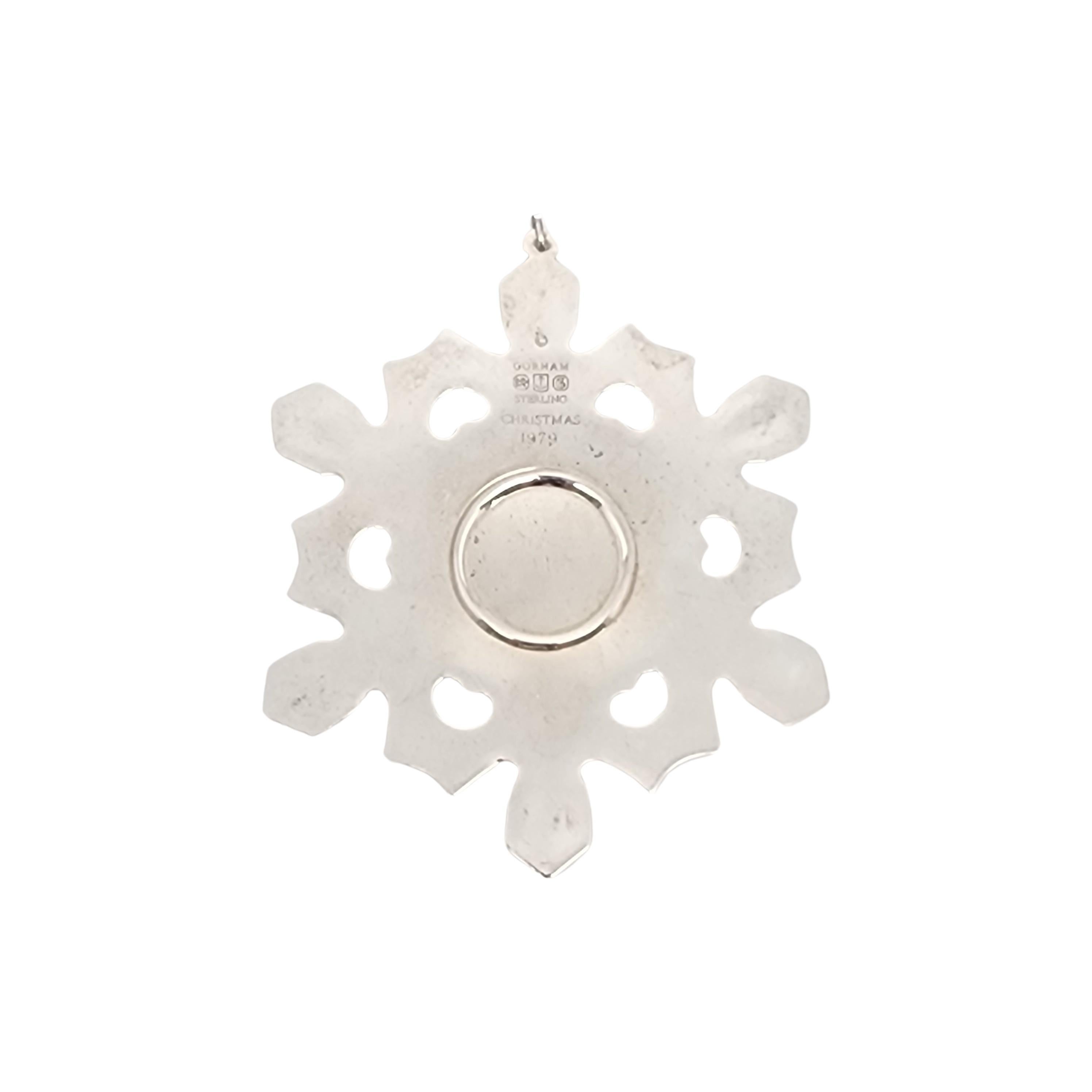 Gorham sterling silver snowflake ornament from 1979.

Since 1970, Gorham has been celebrating the season with a yearly version of the classic snowflake form, creating a beautiful tradition of sparkling art.

Measures approx 3 1/2