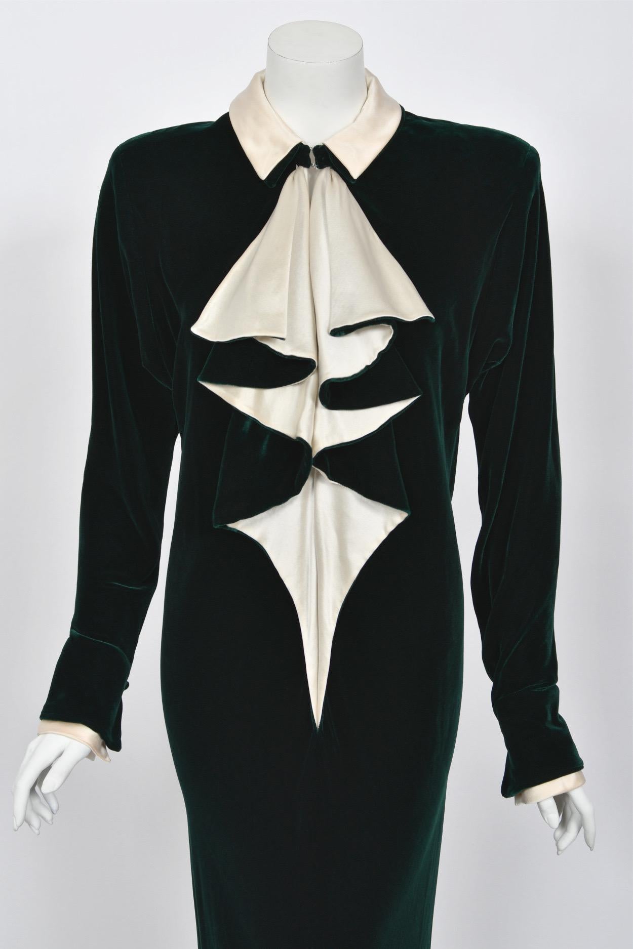 An ultra rare and truly breathtaking Halston couture forest-green silk velvet and ivory satin bias-cut evening gown dating back to the late 1970's. Halston revolutionized the way women dress and is one of the few designers, alongside Claire