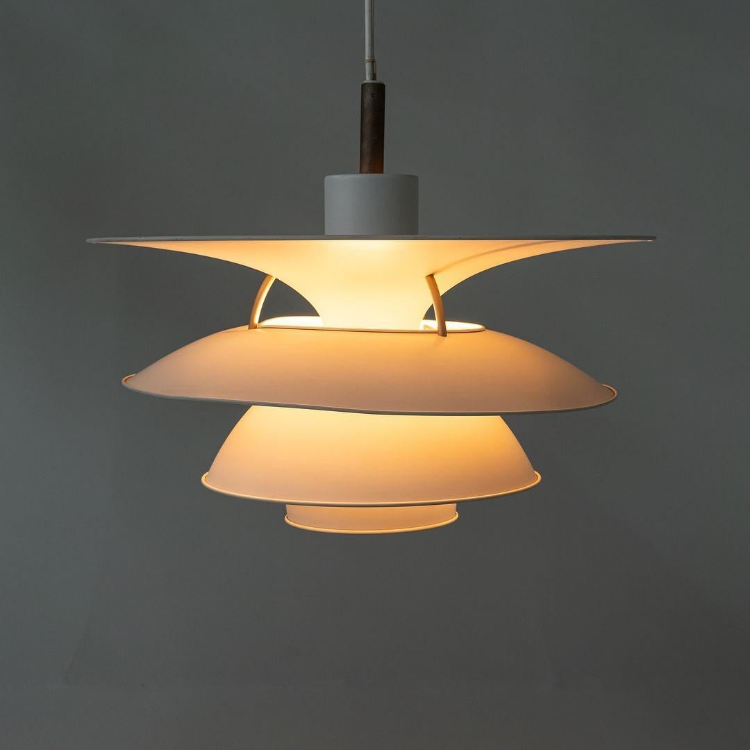 This is a PH 6 - 6 1/2 Charlottenborg Pendant Light, initially designed by Poul Henningsen for Louis Poulsen in Denmark in 1925. These examples date to ca. 1979. The listed price includes one pendant, and we have four pendants available for