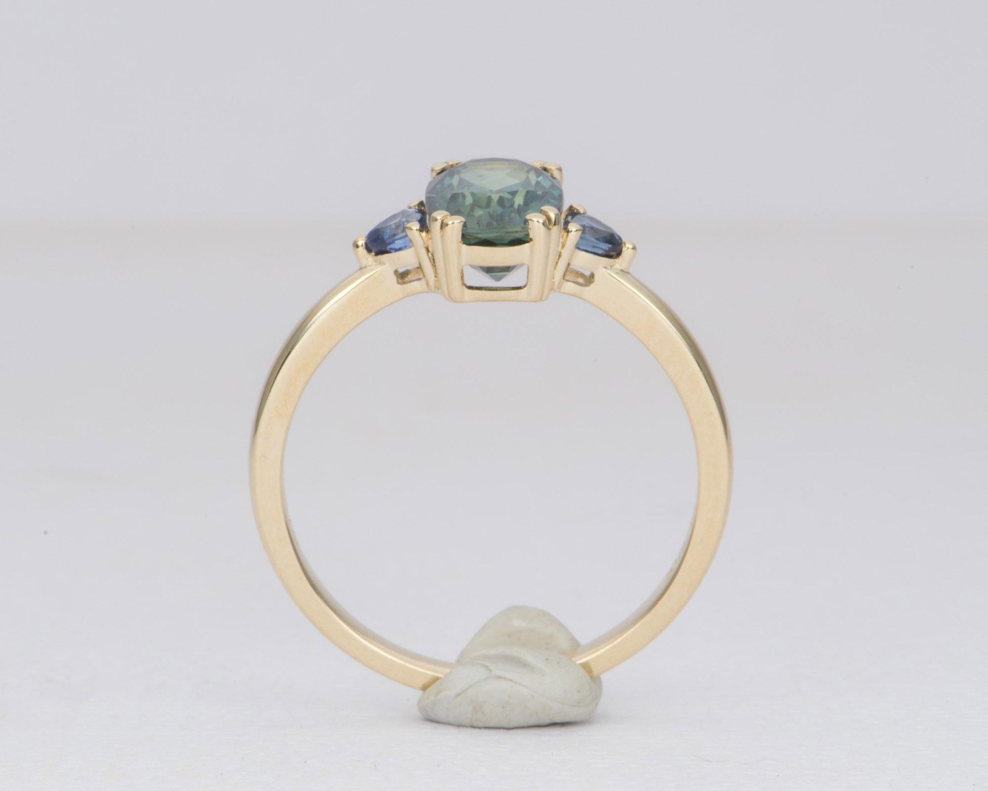 teal sapphire yellow gold ring
