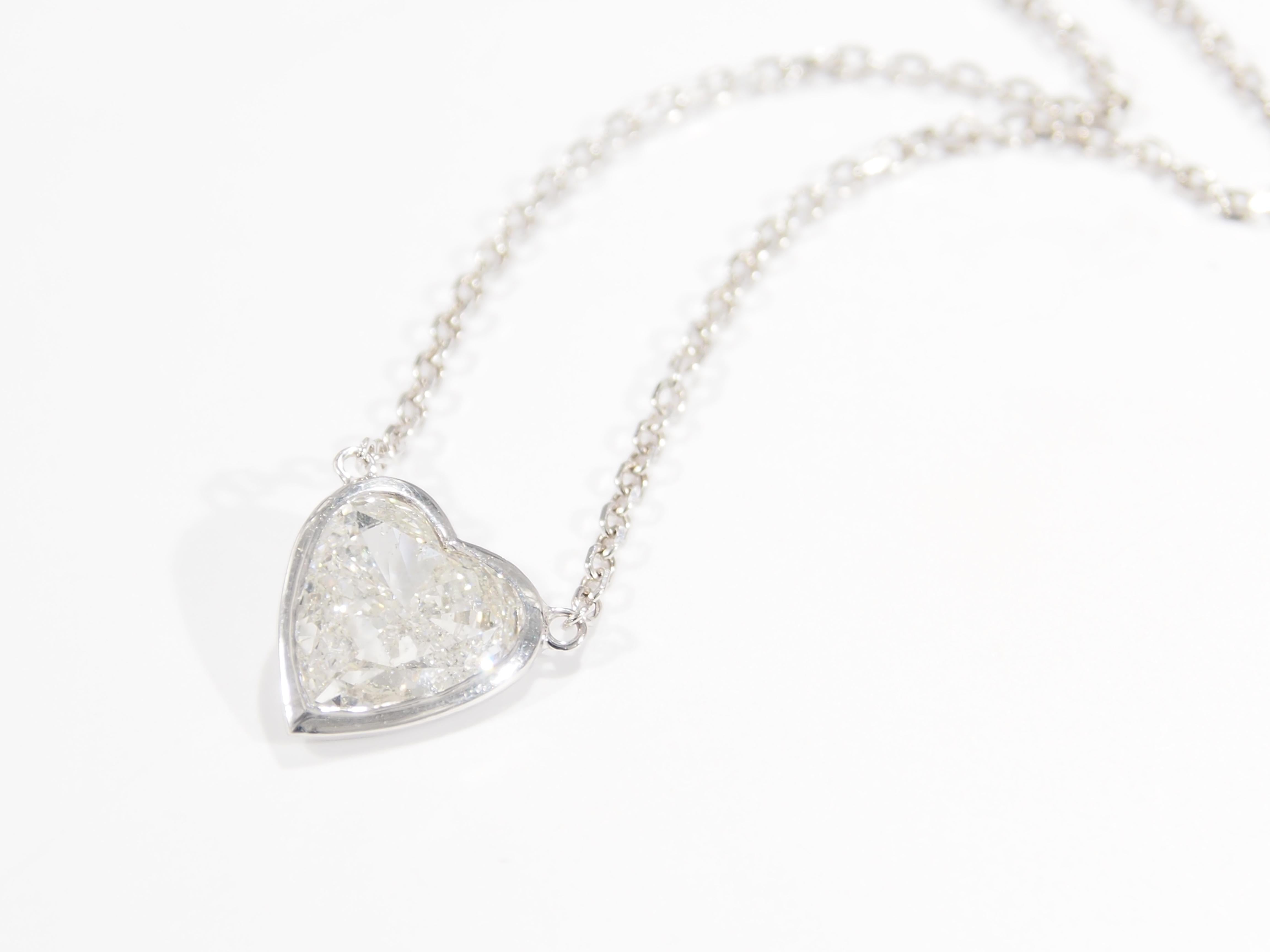 This is a sparkling 14K White Gold Diamond Heart Necklace. What makes this necklace so intriguing is that the Heart is not a cluster but (1) Heart Shape Diamond, approximately 1.98ct, I in Color, SI3 in Clarity. A lustrous Diamond Necklace that can