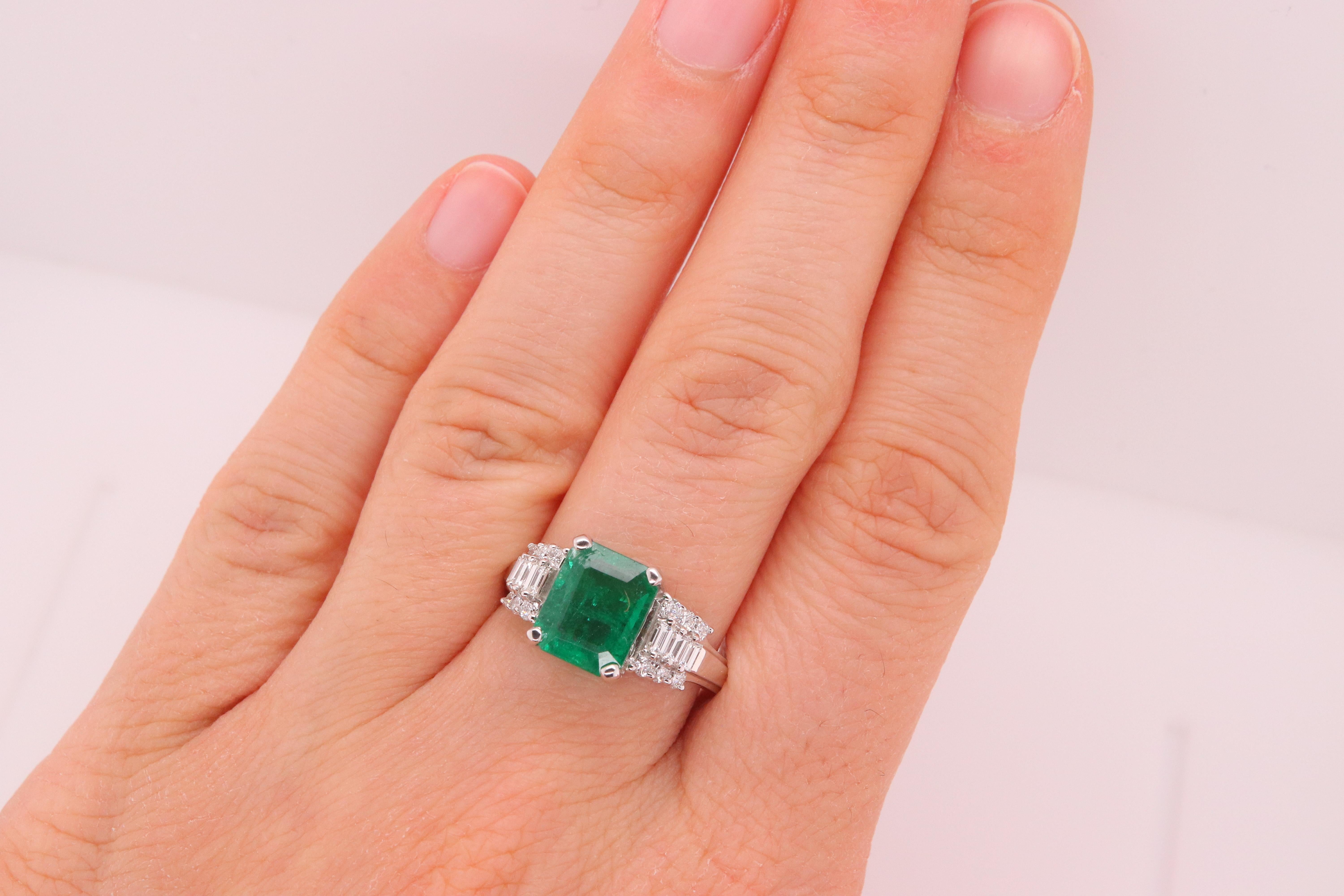 Material: 18k White Gold 
Center Stone Details: 1 Emerald Cut Emerald at 1.98 Carats - Measuring 9 x 7.3 mm
Diamond Details: 6 Baguette Diamonds at 0.24 Carats - Clarity: VS-SI / Color: G-H
Alberto offers complimentary sizing on all rings.

Fine