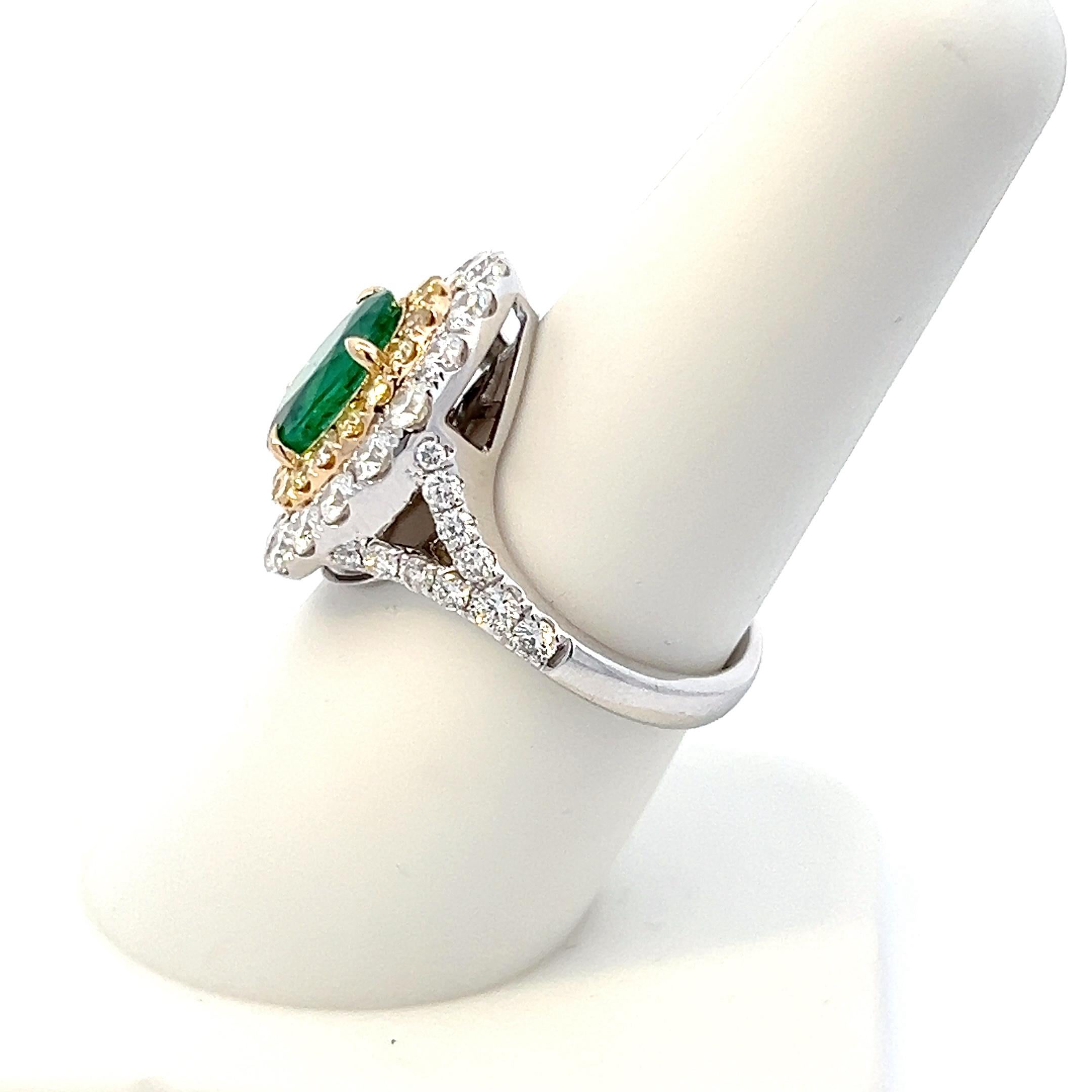 Introducing our exquisite Emerald and Diamond Ring, a true testament to timeless elegance and sophistication. This enchanting piece is crafted in lustrous 18K white gold, with a unique touch of yellow gold in the inner halo, adding a subtle contrast