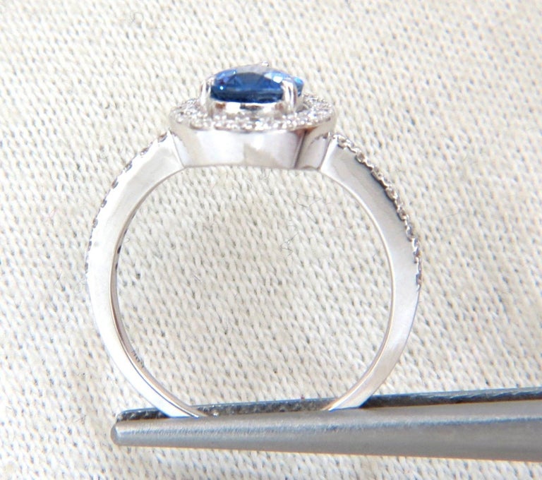 1.48ct. Natural Royal blue sapphire halo ring.

Pear cut, Fully Faceted and brilliant blue sparkles throughout

.50ct. diamonds.

Rounds and full cuts.

G color, Vs-2 clarity.

14kt. white gold 

Deck of ring: 13.3 X 10.2mm

depth of ring: