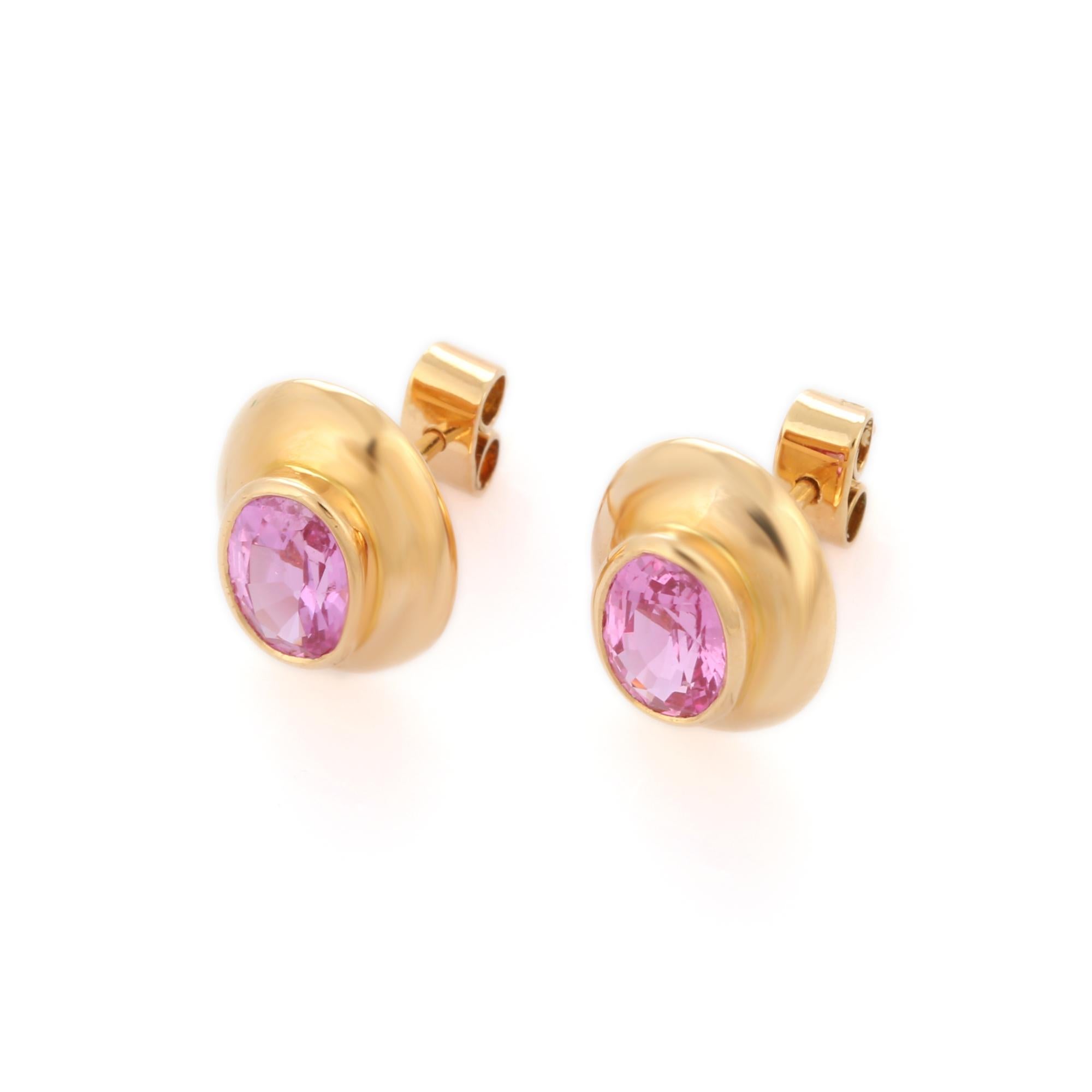 Studs create a subtle beauty while showcasing the colors of the natural precious gemstones making a statement.

Oval cut pink sapphire studs in 18K gold. Embrace your look with these stunning pair of earrings suitable for any occasion to complete