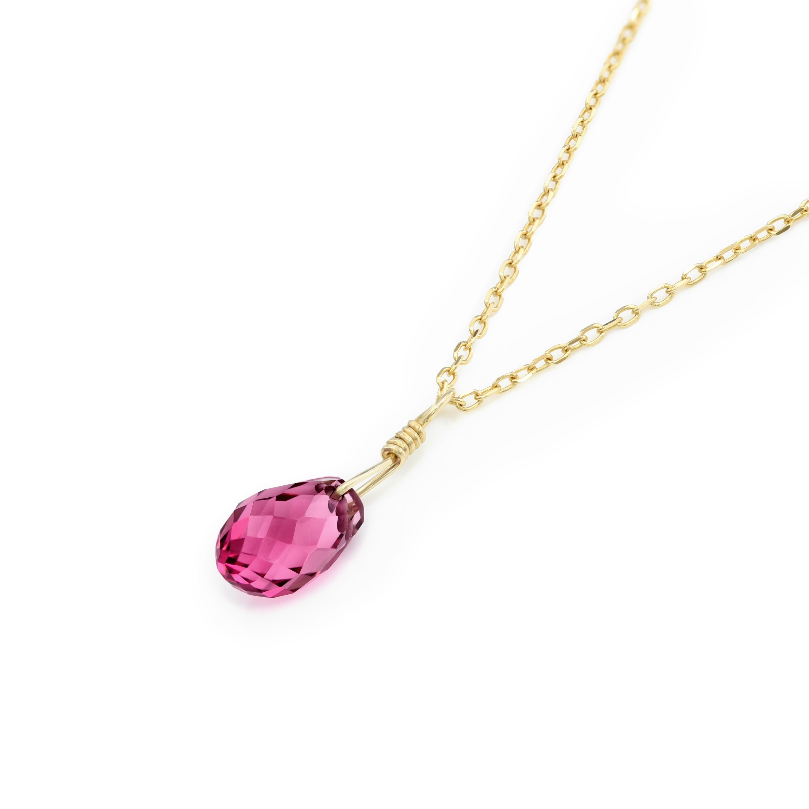 Elevate your elegance with the Pink Tourmaline Pendant. Embellished with 1.98 carats briolette shaped gem from Brazil, it graces a 14K Yellow Gold setting with an 18 inches Spring Chain. Measuring 8 x 5.2 mm, its radiant presence shines. The gem's